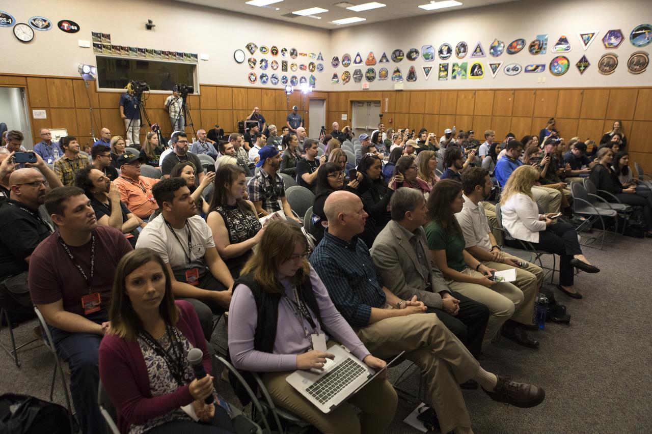 Members of the media, along with NASA and SpaceX officials, gather in the Kennedy Space Center’s Mission Briefing Room of the Neil Armstrong Operations and Checkout Building on Thursday, Feb. 28. The briefing focused on launch of the SpaceX Demo-1 Commercial Crew Program mission to the International Space Station. The inaugural flight of the Crew Dragon, known as Demo-1, will be uncrewed, lifting off atop a SpaceX Falcon 9 rocket from Launch Complex 39A at Kennedy Saturday, March 2, at 2:49 a.m. EST. The mission is designed to validate end-to-end systems and capabilities, leading to certification to fly crew. NASA has worked with SpaceX and Boeing in developing the CCP spacecraft to facilitate new human spaceflight systems launching from U.S. soil with the goal of safe, reliable and cost-effective access to low-Earth orbit destinations such as the space station.