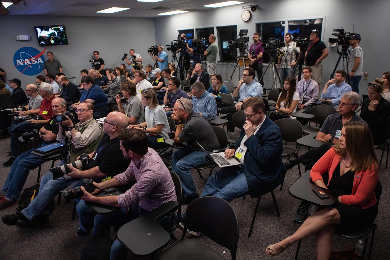 Members of the media gather in the Kennedy Space Center’s Press Site auditorium during a prelaunch news conference with NASA, SpaceX and the 45th Weather Squadron leaders Thursday, Feb. 28, prior to the Saturday, March 2 launch of the SpaceX Demo-1 Commercial Crew Program (CCP) mission to the International Space Station. The inaugural flight of the SpaceX Crew Dragon, known as Demo-1, is scheduled to lift off from Kennedy’s Launch Complex 39A Saturday at 2:49 EST. A SpaceX Falcon 9 rocket will launch the uncrewed spacecraft on a mission designed to validate end-to-end systems and capabilities, leading to certification to fly crew. NASA has worked with SpaceX and Boeing in developing the Commercial Crew Program spacecraft to facilitate new human spaceflight systems launching from U.S. soil with the goal of safe, reliable and cost-effective access to low-Earth orbit destinations, such as the International Space Station.