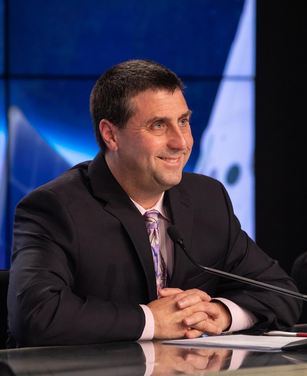 Joel Montalbano, deputy manager, International Space Station Program, speaks to members of the media during a prelaunch news conference with NASA, SpaceX and the 45th Weather Squadron leaders Thursday, Feb. 28, prior to the Saturday, March 2 launch of the SpaceX Demo-1 Commercial Crew Program (CCP) mission to the International Space Station. The inaugural flight of the SpaceX Crew Dragon, known as Demo-1, is scheduled to lift off from Kennedy’s Launch Complex 39A Saturday at 2:49 EST. A SpaceX Falcon 9 rocket will launch the uncrewed spacecraft on a mission designed to validate end-to-end systems and capabilities, leading to certification to fly crew. NASA has worked with SpaceX and Boeing in developing the Commercial Crew Program spacecraft to facilitate new human spaceflight systems launching from U.S. soil with the goal of safe, reliable and cost-effective access to low-Earth orbit destinations, such as the International Space Station.