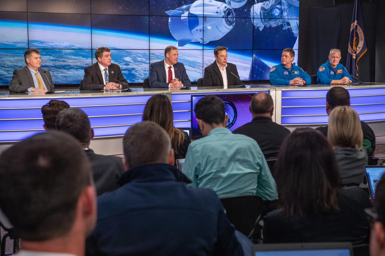 In Kennedy Space Center’s Press Site auditorium, agency and industry leaders speak to members of the media during a post launch news conference following the March 2, 2:49 a.m. EST launch of the SpaceX Demo-1 Commercial Crew Program (CCP) mission to the International Space Station. From left are:  Steve Stich, NASA launch manager, Commercial Crew Program; Kirk Shireman, manager, International Space Station Program; Jim Bridenstine, NASA administrator; Elon Musk, CEO and lead designer, SpaceX; Bob Behnken, NASA astronaut and Doug Hurley, NASA astronaut. The Crew Dragon’s trip to the space station is designed to validate end-to-end systems and capabilities, leading to certification to fly crew. NASA has worked with SpaceX and Boeing in developing the CCP spacecraft to facilitate new human spaceflight systems launching from U.S. soil with the goal of safe, reliable and cost-effective access to low-Earth orbit destinations, such as the space station. 