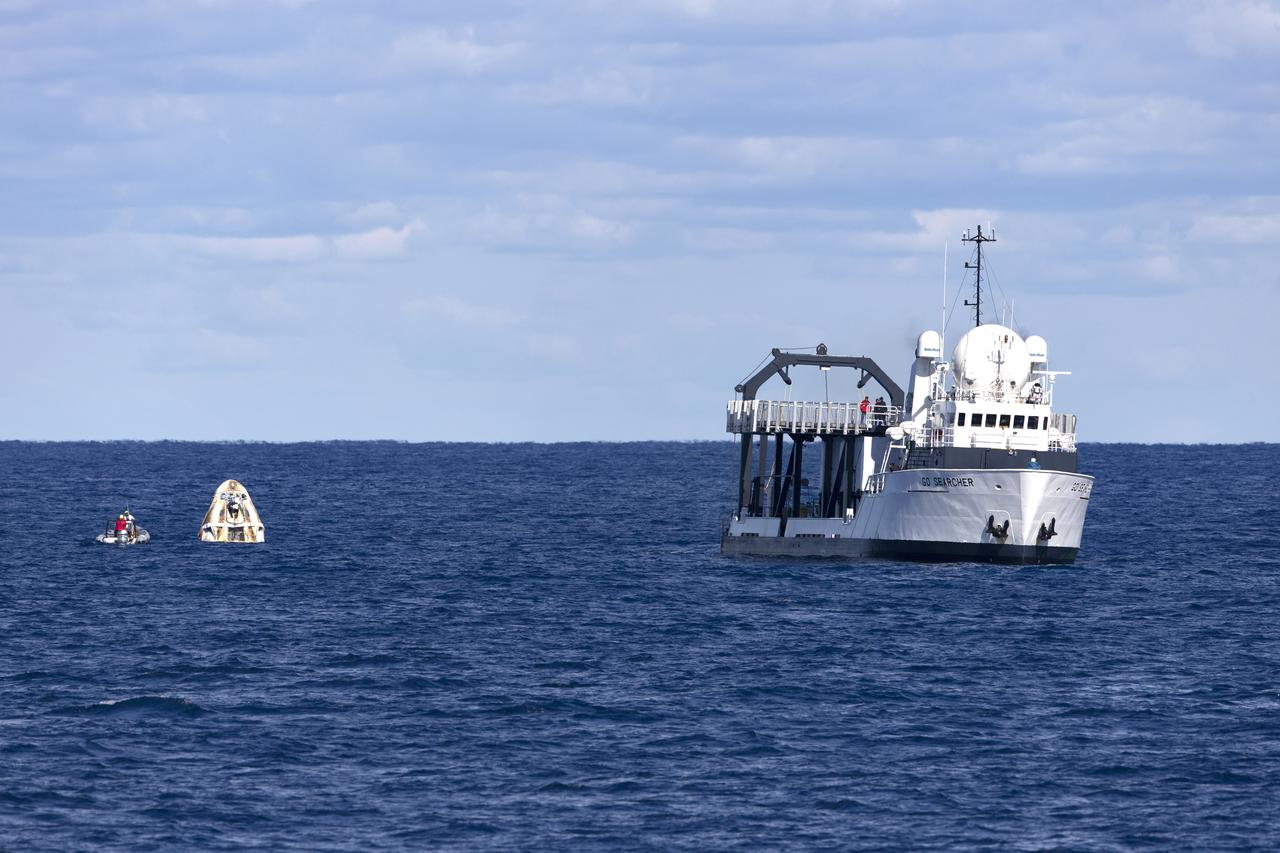 SpaceX’s recovery ship, Go Searcher, prepares to retrieve the company’s Crew Dragon from the Atlantic Ocean, about 200 miles off the east coast of Florida, March 8, 2019. The uncrewed spacecraft docked to the orbiting laboratory on March 3, following a 2:49 a.m. EST liftoff aboard a SpaceX Falcon 9 rocket from Launch Complex 39A at NASA’s Kennedy Space Center in Florida on March 2. The spacecraft undocked at 2:32 a.m., March 8, splashing down in the Atlantic Ocean at 8:45 a.m. SpaceX’s inaugural flight with NASA’s Commercial Crew Program, known as Demo-1, is the first flight test of a space system designed for humans built and operated by a commercial company through a public-private partnership. NASA and SpaceX will use data from Demo-1 to further prepare for Demo-2, the crewed flight test that will carry NASA astronauts Bob Behnken and Doug Hurley to the International Space Station later this year.