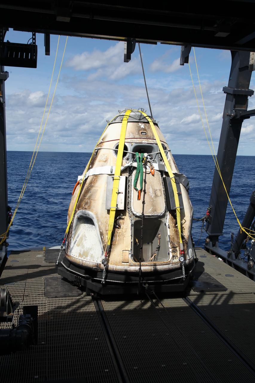SpaceX’s Crew Dragon is loaded onto the company’s recovery ship, Go Searcher, in the Atlantic Ocean, about 200 miles off Florida’s east coast, on March 8, after returning from the International Space Station on the Demo-1 mission. The uncrewed spacecraft docked to the orbiting laboratory on March 3, following a 2:49 a.m. EST liftoff aboard a SpaceX Falcon 9 rocket from Launch Complex 39A at NASA’s Kennedy Space Center in Florida on March 2. The spacecraft undocked at 2:32 a.m., March 8, splashing down in the Atlantic Ocean, at 8:45 a.m. SpaceX’s inaugural flight with NASA’s Commercial Crew Program is the first flight test of a space system designed for humans built and operated by a commercial company through a public-private partnership. NASA and SpaceX will use data from Demo-1 to further prepare for Demo-2, the crewed flight test that will carry NASA astronauts Bob Behnken and Doug Hurley to the International Space Station later this year.