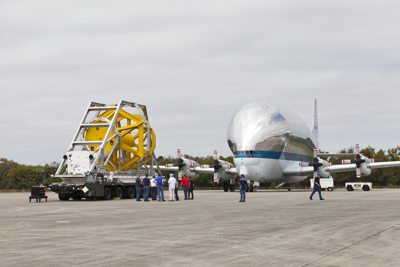 A fit check of the Orion Crew and Service Module Horizontal Transporter (CHT) with NASA's Super Guppy aircraft began March 12, 2019, at NASA Kennedy Space Center’s Shuttle Landing Facility in Florida, operated by Space Florida. In this photo, the CHT is secured on the U.S. Air Force aircraft loader. The fit check is being performed to confirm loading operations, ensure that the CHT fits inside the Super Guppy and test the electrical interface to aircraft power. The Orion crew and service modules will be readied for a trip to NASA’s Plum Brook Station in Sandusky, Ohio, for full thermal vacuum testing. In this unique facility, the crew and service modules will be put through extensive testing to ensure they can survive the rigors of launch, space travel, re-entry and splashdown. The Orion spacecraft will launch atop the agency's Space Launch System rocket on Exploration Mission-1. 