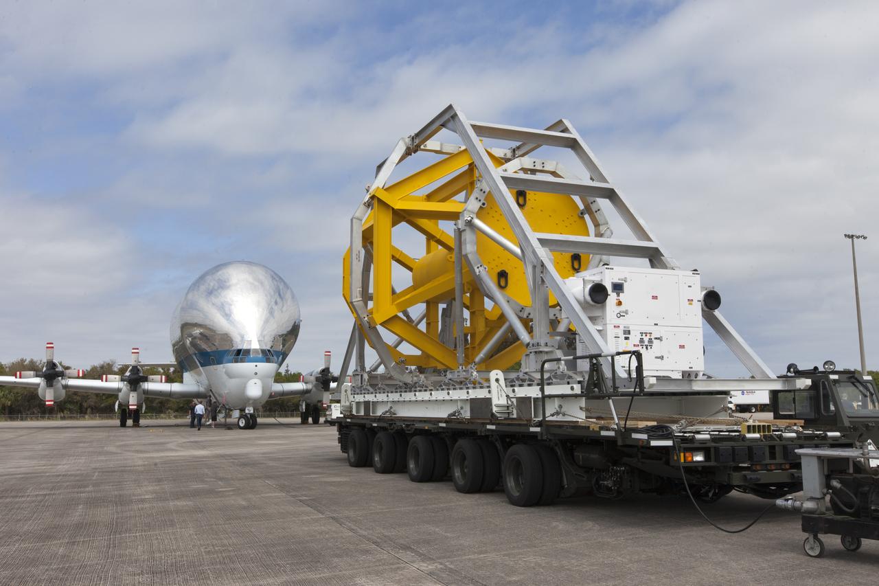 A fit check of the Orion Crew and Service Module Horizontal Transporter (CHT) with NASA's Super Guppy aircraft began March 12, 2019, at NASA Kennedy Space Center’s Shuttle Landing Facility in Florida, operated by Space Florida. In this photo, the CHT is secured on the U.S. Air Force aircraft loader. The fit check is being performed to confirm loading operations, ensure that the CHT fits inside the Super Guppy and test the electrical interface to aircraft power. The Orion crew and service modules will be readied for a trip to NASA’s Plum Brook Station in Sandusky, Ohio, for full thermal vacuum testing. In this unique facility, the crew and service modules will be put through extensive testing to ensure they can survive the rigors of launch, space travel, re-entry and splashdown. The Orion spacecraft will launch atop the agency's Space Launch System rocket on Exploration Mission-1. 