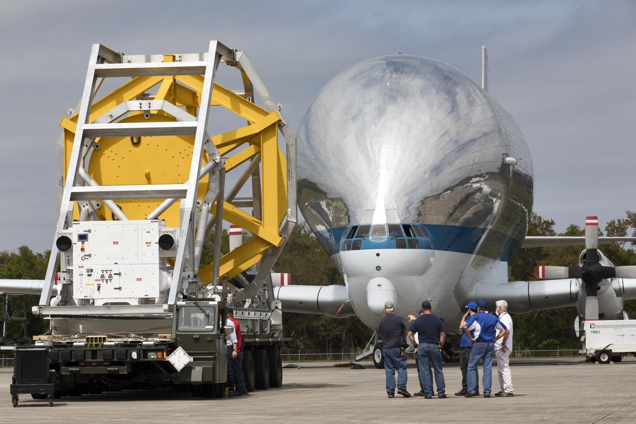 A fit check of the Orion Crew and Service Module Horizontal Transporter (CHT) with NASA's Super Guppy aircraft began March 12, 2019, at NASA Kennedy Space Center’s Shuttle Landing Facility in Florida, operated by Space Florida. In this photo, the CHT is secured on the U.S. Air Force aircraft loader and is moved toward the Super Guppy. The fit check is being performed to confirm loading operations, ensure that the CHT fits inside the Super Guppy and test the electrical interface to aircraft power. The Orion crew and service modules will be readied for a trip to NASA’s Plum Brook Station in Sandusky, Ohio, for full thermal vacuum testing. In this unique facility, the crew and service modules will be put through extensive testing to ensure they can survive the rigors of launch, space travel, re-entry and splashdown. The Orion spacecraft will launch atop the agency's Space Launch System rocket on Exploration Mission-1. 
