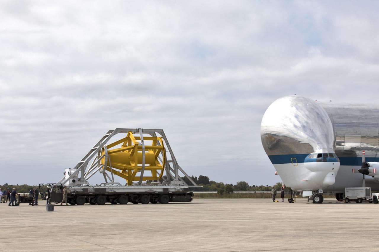 A fit check of the Orion Crew and Service Module Horizontal Transporter (CHT) with NASA's Super Guppy aircraft began March 12, 2019, at NASA Kennedy Space Center’s Shuttle Landing Facility in Florida, operated by Space Florida. In this photo, the U.S. Air Force aircraft loader with the CHT is moved toward the Super Guppy. The fit check is being performed to confirm loading operations, ensure that the CHT fits inside the Super Guppy and test the electrical interface to aircraft power. The Orion crew and service modules will be readied for a trip to NASA’s Plum Brook Station in Sandusky, Ohio, for full thermal vacuum testing. In this unique facility, the crew and service modules will be put through extensive testing to ensure they can survive the rigors of launch, space travel, re-entry and splashdown. The Orion spacecraft will launch atop the agency's Space Launch System rocket on Exploration Mission-1. 
