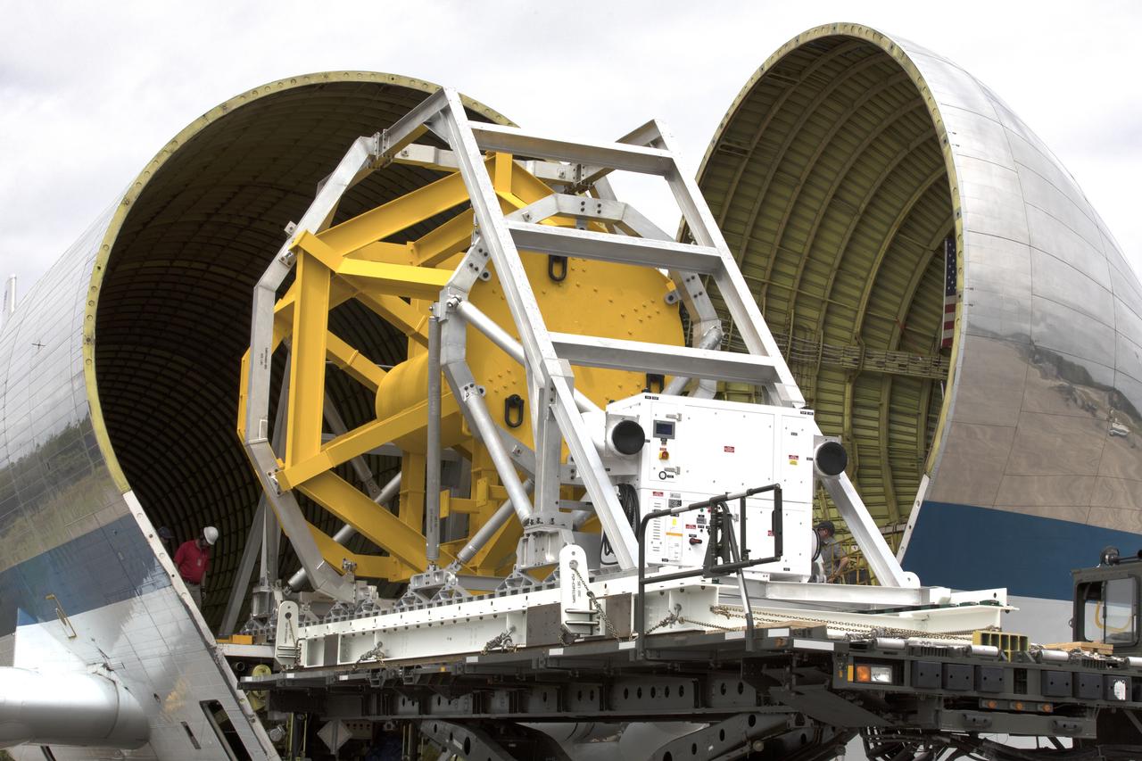 A fit check of the Orion Crew and Service Module Horizontal Transporter (CHT) with NASA's Super Guppy aircraft began March 12, 2019, at NASA Kennedy Space Center’s Shuttle Landing Facility in Florida, operated by Space Florida. In this photo, the Super Guppy’s payload bay is opened as the CHT, secured on the U.S. Air Force aircraft loader, is moved inside the aircraft’s payload bay. The fit check is being performed to confirm loading operations, ensure that the CHT fits inside the Super Guppy and test the electrical interface to aircraft power. The Orion crew and service modules will be readied for a trip to NASA’s Plum Brook Station in Sandusky, Ohio, for full thermal vacuum testing. In this unique facility, the crew and service modules will be put through extensive testing to ensure they can survive the rigors of launch, space travel, re-entry and splashdown. The Orion spacecraft will launch atop the agency's Space Launch System rocket on Exploration Mission-1. 