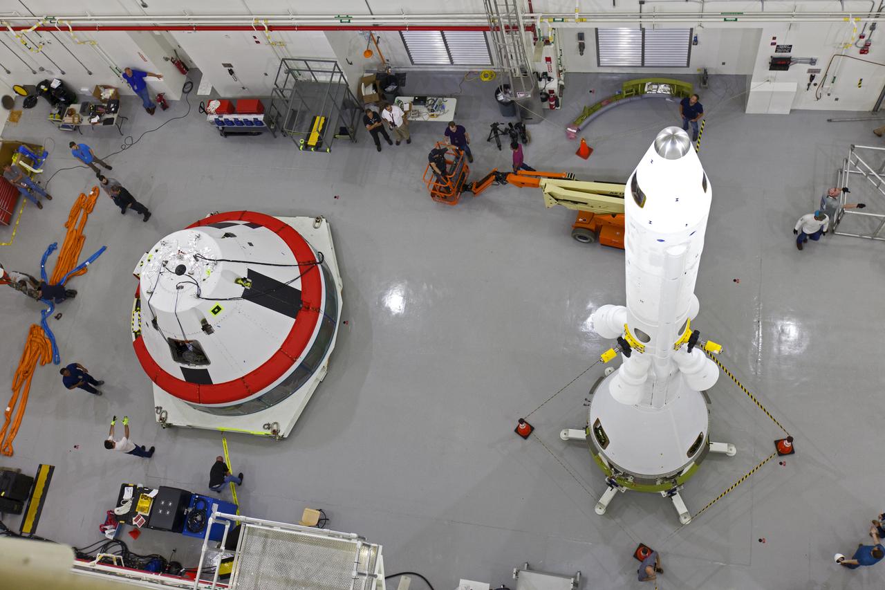 A test version of the Orion crew module, at left, and the Launch Abort System (LAS) are inside the Launch Abort System Facility (LASF) at NASA’s Kennedy Space Center in Florida on March 13, 2019, where they will be integrated. The fully functional LAS will be used for the Orion Ascent Abort-2 (AA-2) Flight Test, a full-stress test of the LAS that will launch from Space Launch Complex 46, carrying a 22,000-pound Orion test vehicle to an altitude of 31,000 feet and traveling at more than 1,000 miles an hour. The test will verify the LAS can steer the crew module and astronauts aboard to safety in the event of an issue with the Space Launch System (SLS) rocket when the spacecraft is under the highest aerodynamic loads it will experience during a rapid climb into space. NASA's Orion and Exploration Ground Systems programs and contractors from Jacob's and Northrop Grumman in conjunction with the Air Force Space and Missile Center's Launch Operations branch are performing flight operations for AA-2.