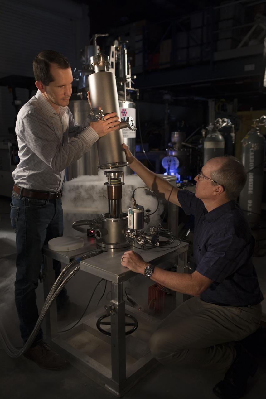 Adam Swanger (left) and James Fesmire assemble a cryocooler-based low temperature materials test in the Cryogenics Test Laboratory at NASA's Kennedy Space Center on Mar. 20, 2019.