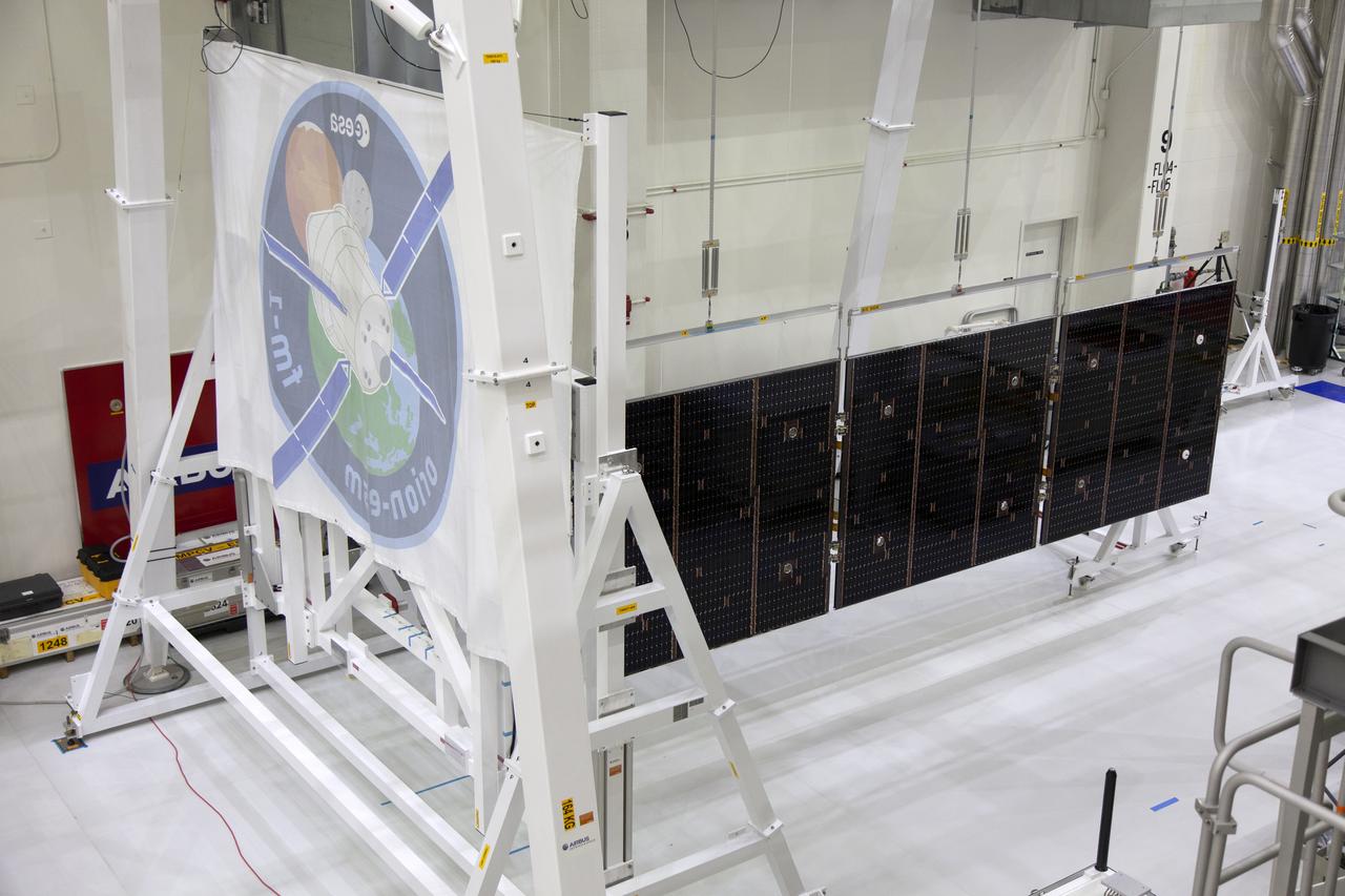 A solar array for the European Service Module that will serve as the powerhouse for Orion, is being prepared for Exploration Mission-1 (EM-1) inside the Neil Armstrong Operations and Checkout Building high bay on March 21, 2019, at NASA’s Kennedy Space Center in Florida. Orion will launch atop the Space Launch System rocket from Launch Pad 39B. The spacecraft will travel thousands of miles past the Moon on an approximately three-week test flight. Orion will return to Earth and splashdown in the Pacific Ocean off the coast of California, where it will be retrieved and returned to Kennedy.