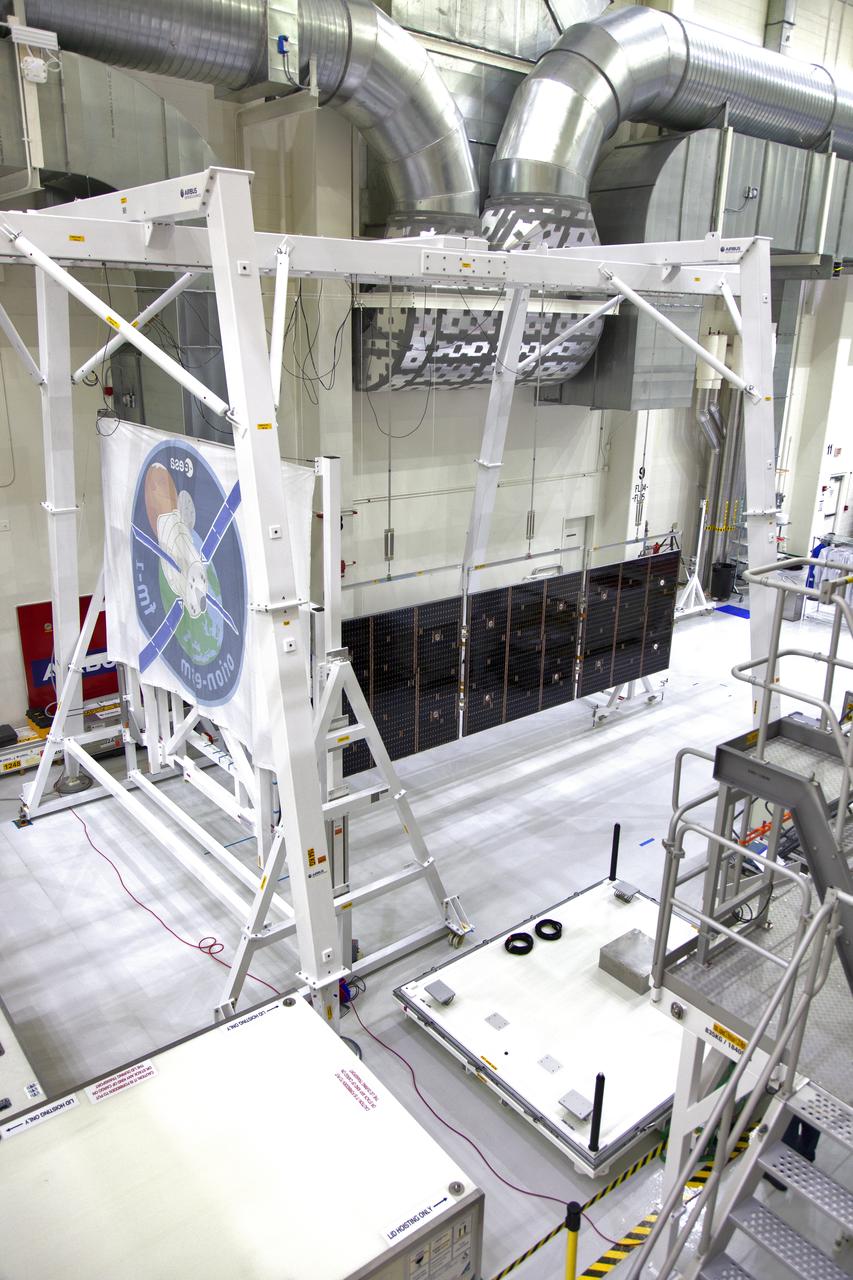 A solar array for the European Service Module that will serve as the powerhouse for Orion, is being prepared for Exploration Mission-1 (EM-1) inside the Neil Armstrong Operations and Checkout Building high bay on March 21, 2019, at NASA’s Kennedy Space Center in Florida. Orion will launch atop the Space Launch System rocket from Launch Pad 39B. The spacecraft will travel thousands of miles past the Moon on an approximately three-week test flight. Orion will return to Earth and splashdown in the Pacific Ocean off the coast of California, where it will be retrieved and returned to Kennedy.