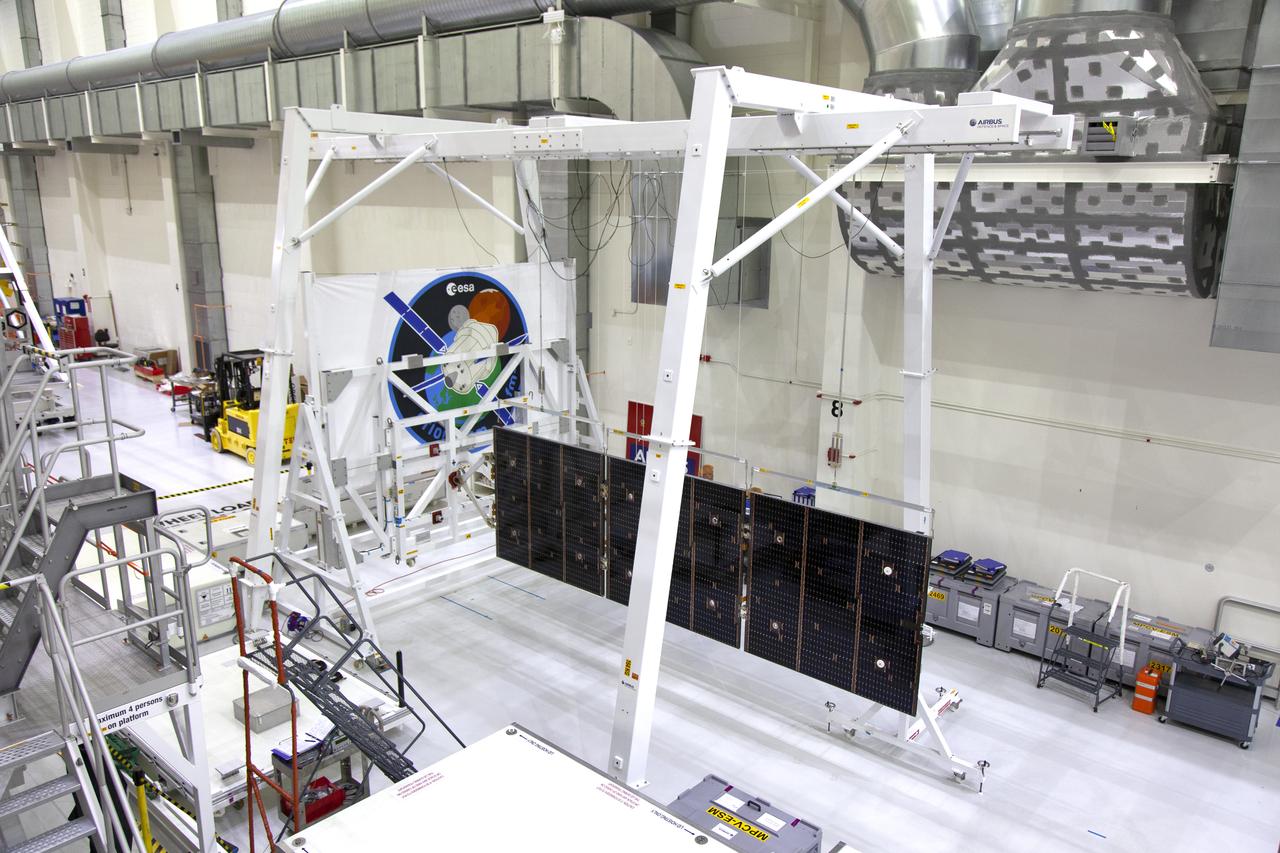 A solar array for the European Service Module that will serve as the powerhouse for Orion, is being prepared for Exploration Mission-1 (EM-1) inside the Neil Armstrong Operations and Checkout Building high bay on March 21, 2019, at NASA’s Kennedy Space Center in Florida. Orion will launch atop the Space Launch System rocket from Launch Pad 39B. The spacecraft will travel thousands of miles past the Moon on an approximately three-week test flight. Orion will return to Earth and splashdown in the Pacific Ocean off the coast of California, where it will be retrieved and returned to Kennedy.