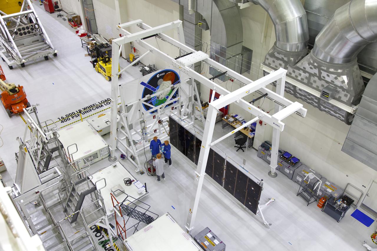 A solar array for the European Service Module that will serve as the powerhouse for Orion, is being prepared for Exploration Mission-1 (EM-1) inside the Neil Armstrong Operations and Checkout Building high bay on March 21, 2019, at NASA’s Kennedy Space Center in Florida. Orion will launch atop the Space Launch System rocket from Launch Pad 39B. The spacecraft will travel thousands of miles past the Moon on an approximately three-week test flight. Orion will return to Earth and splashdown in the Pacific Ocean off the coast of California, where it will be retrieved and returned to Kennedy.