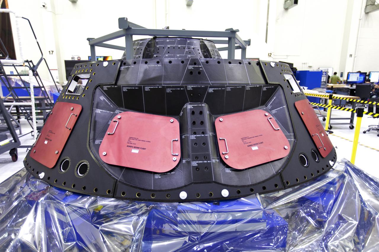 The forward bay cover for Orion for Exploration Mission-1 (EM-1) is in view inside the Neil Armstrong Operations and Checkout Building high bay on March 21, 2019, at NASA’s Kennedy Space Center in Florida. For EM-1, Orion will launch atop the Space Launch System rocket from Launch Pad 39B. The spacecraft will travel thousands of miles past the Moon on an approximately three-week test flight. Orion will return to Earth and splashdown in the Pacific Ocean off the coast of California, where it will be retrieved and returned to Kennedy.