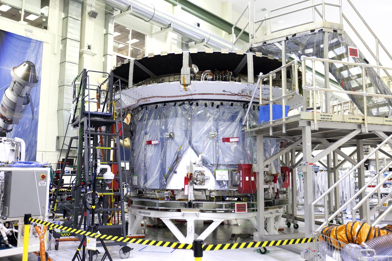 The European Service Module that will service as the powerhouse for Orion for Exploration Mission-1 (EM-1), is in view on a work stand inside the Neil Armstrong Operations and Checkout Building high bay on March 21, 2019, at NASA’s Kennedy Space Center in Florida. For EM-1, Orion will launch atop the Space Launch System rocket from Launch Pad 39B. The spacecraft will travel thousands of miles past the Moon on an approximately three-week test flight. Orion will return to Earth and splashdown in the Pacific Ocean off the coast of California, where it will be retrieved and returned to Kennedy.