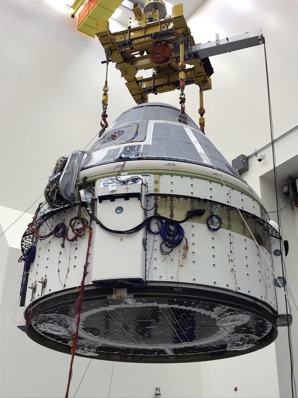Boeing’s CST-100 Starliner is lifted into a test chamber at Boeing’s Space Environment Test Facility in El Segundo, Calif. There, Boeing engineers conducted different environmental qualification test programs, proving the vehicle is capable of withstanding the harsh environments it will see during launch, ascent and orbit. This is the Starliner that will be used for Boeing’s Crew Flight Test as part of NASA’s Commercial Crew Program, which is working with Boeing to return human spaceflight launches to the space station from U.S. soil.