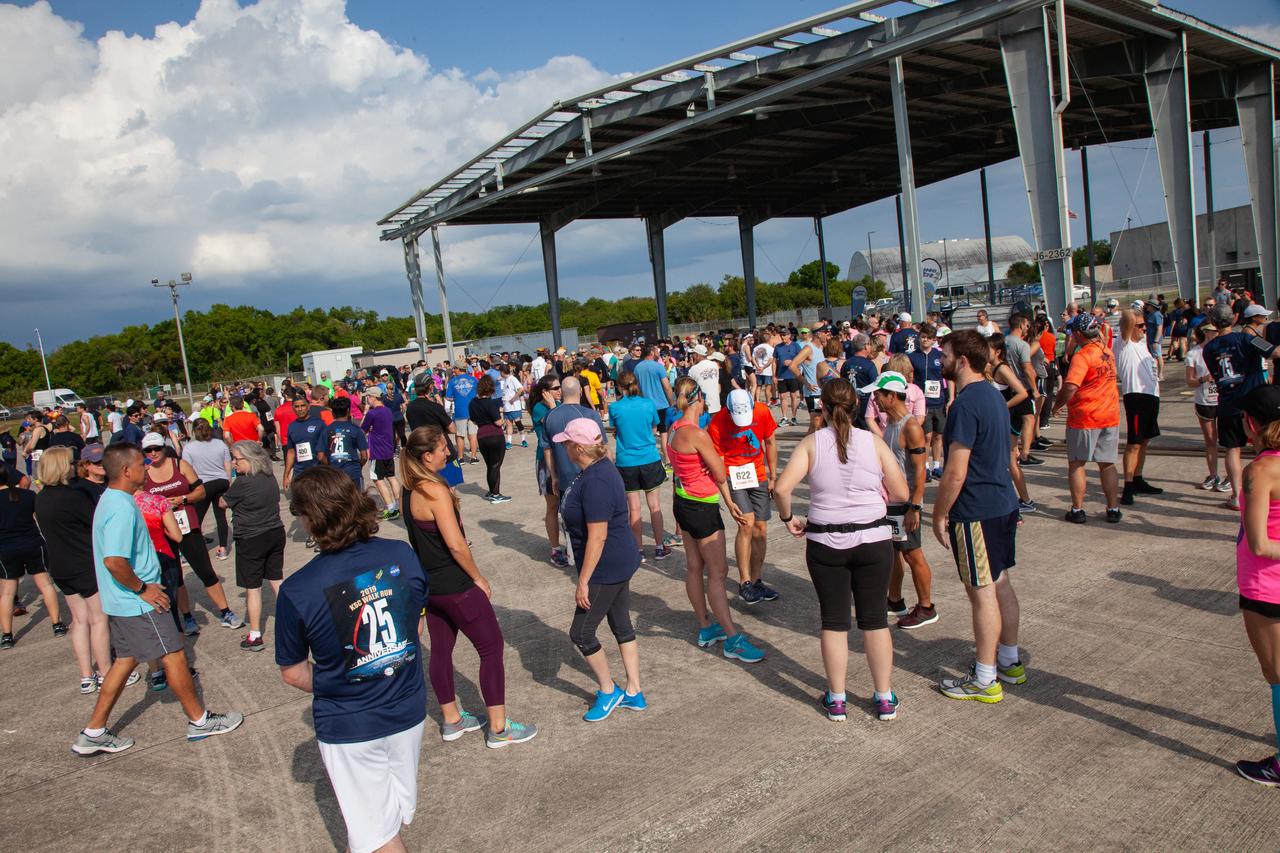 Kennedy Space Center employees and guests converse prior to the start of the Florida spaceport’s annual KSC Walk Run on March 26, 2019. Part of Kennedy’s Safety and Health Days, the event takes place at the Shuttle Landing Facility runway and offers participants the chance to partake in a two-mile walk or run, a 5K or a 10K. 