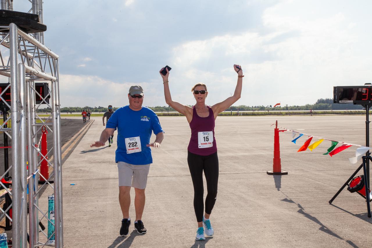 Kennedy Space Center employees and guests cross the finish line during the Florida spaceport’s annual KSC Walk Run on March 26, 2019. Part of Kennedy’s Safety and Health Days, the event takes place at the Shuttle Landing Facility runway and offers participants the chance to partake in a two-mile walk or run, a 5K or a 10K. 