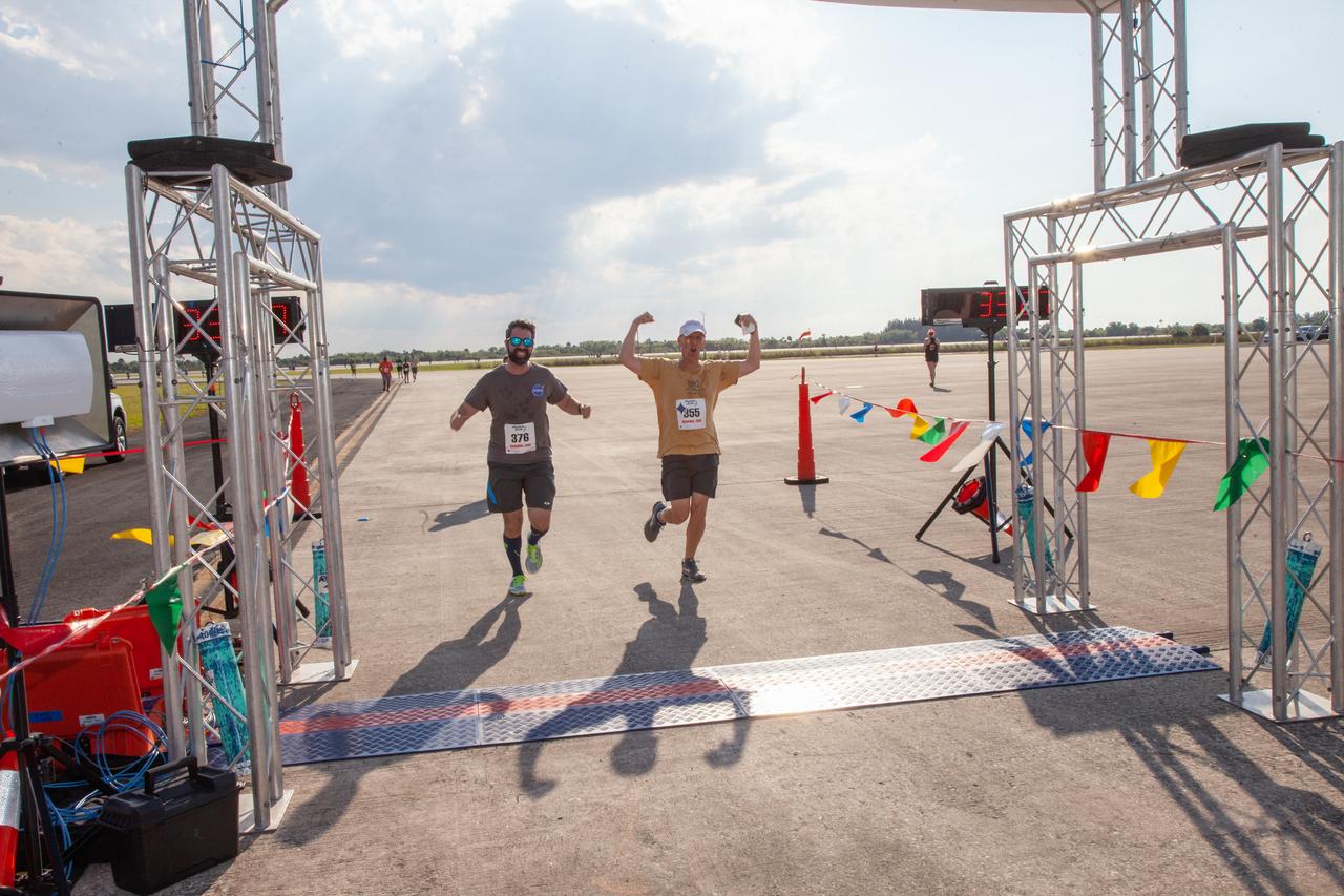 Kennedy Space Center employees and guests cross the finish line during the Florida spaceport’s annual KSC Walk Run on March 26, 2019. Part of Kennedy’s Safety and Health Days, the event takes place at the Shuttle Landing Facility runway and offers participants the chance to partake in a two-mile walk or run, a 5K or a 10K. 