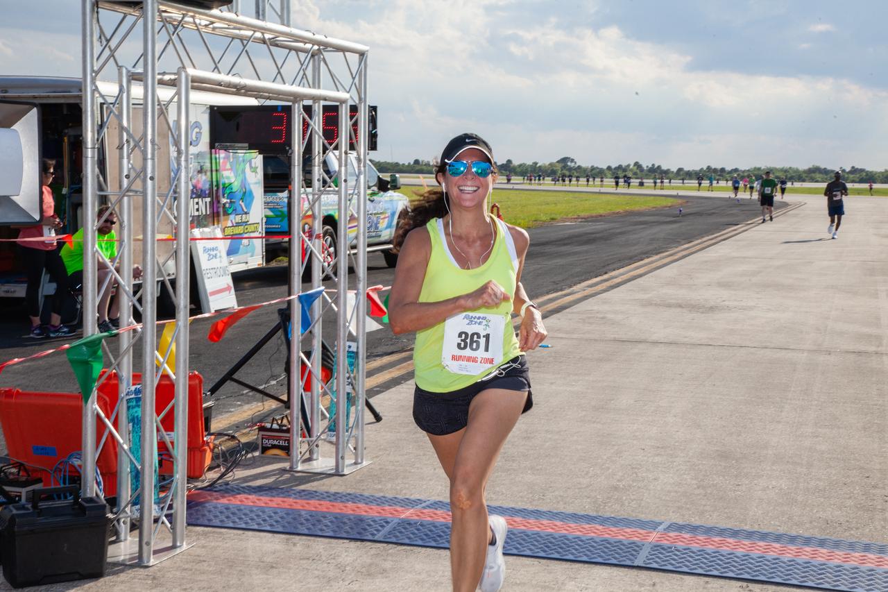 A participant crosses the finish line of Kennedy Space Center’s Walk Run on March 26, 2019. Part of Kennedy’s Safety and Health Days, the annual event takes place at the Florida spaceport’s Shuttle Landing Facility runway and offers employees and guests the chance to partake in a two-mile walk or run, a 5K or a 10K. 