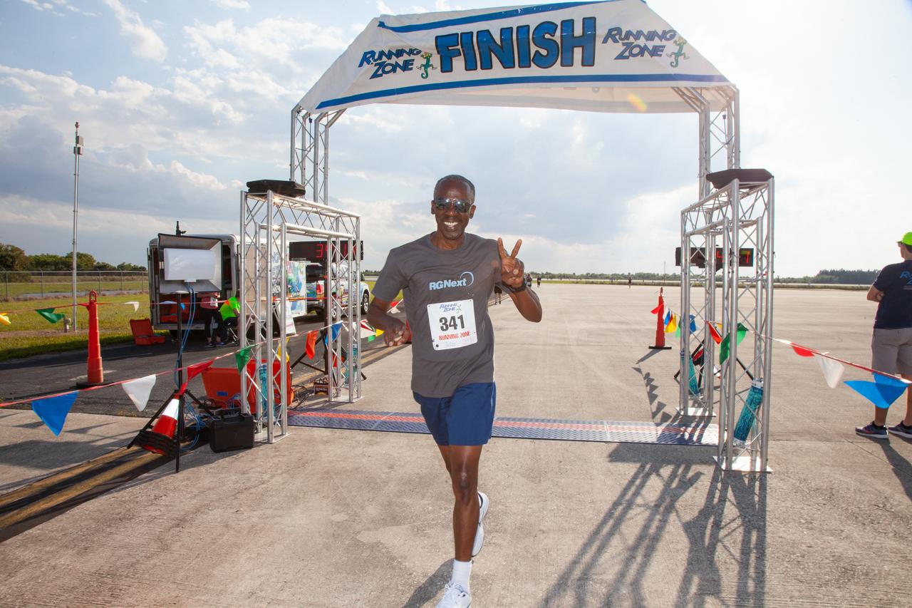 A participant crosses the finish line of Kennedy Space Center’s Walk Run on March 26, 2019. Part of Kennedy’s Safety and Health Days, the annual event takes place at the Florida spaceport’s Shuttle Landing Facility runway and offers employees and guests the chance to partake in a two-mile walk or run, a 5K or a 10K. 