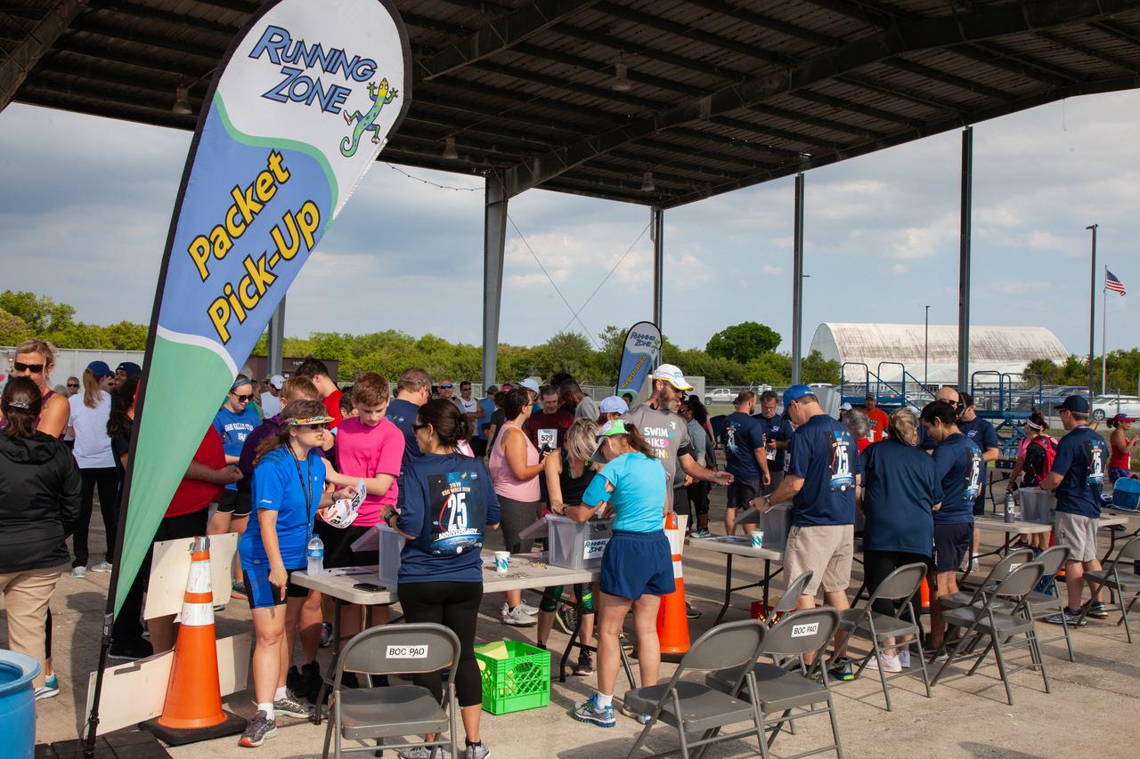 Kennedy Space Center employees and guests receive their race numbers prior to the start of the Florida spaceport’s annual KSC Walk Run on March 26, 2019. Part of Kennedy’s Safety and Health Days, the event takes place at the Shuttle Landing Facility runway and offers participants the chance to partake in a two-mile walk or run, a 5K or a 10K. 