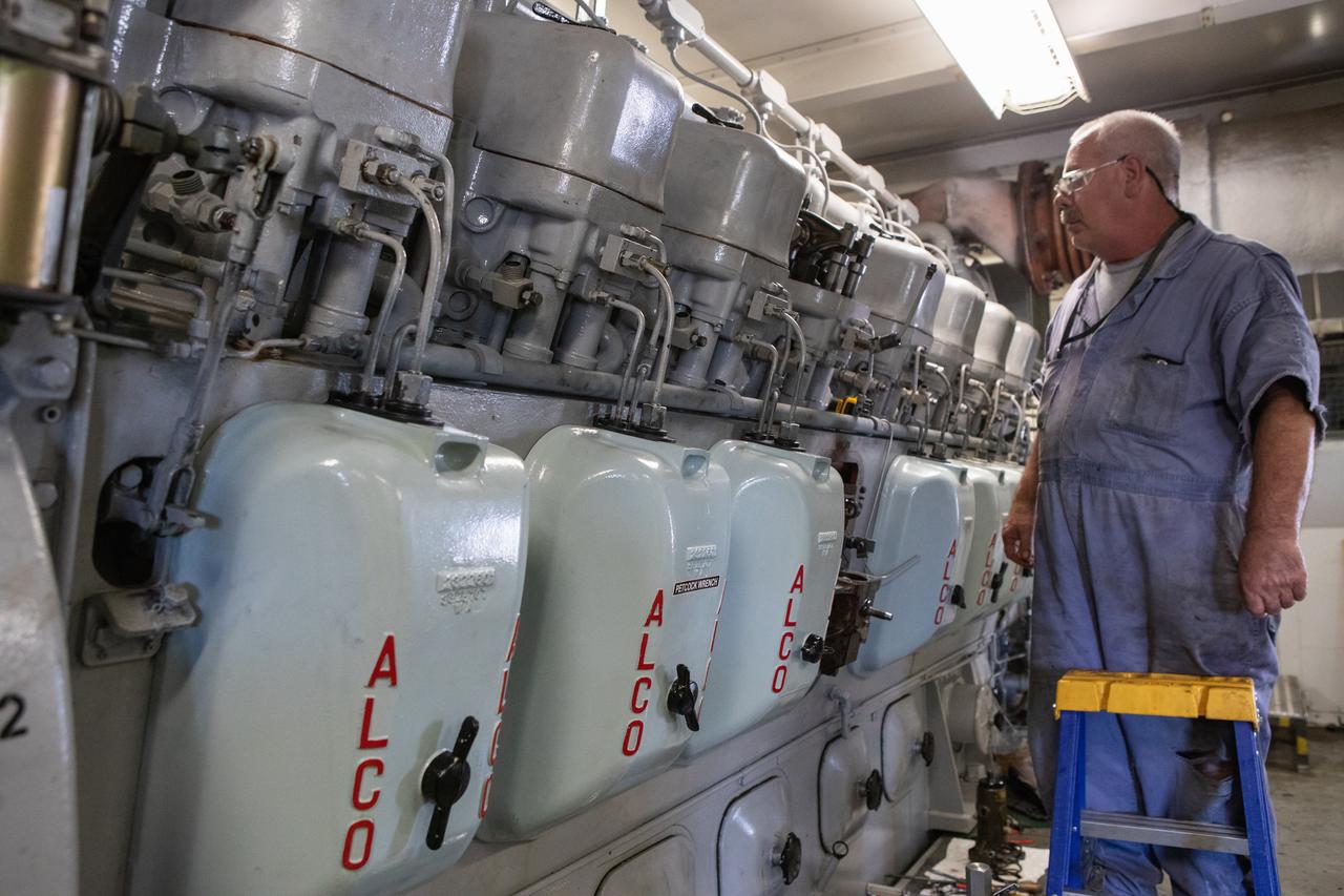 William Vardaman, a mechanical technician with the Jacobs contracting team, performs engine maintenance on NASA's crawler-transporter 2 on March 26, 2019, in the crawler yard located in Kennedy Space Center's Launch Complex 39 area. Recent engine work included rebuilding the vehicles’ fuel pump assemblies and installing new oil pumps that will help minimize future wear. This is one of two crawler-transporters that carried rockets and spacecraft, including the Apollo/Saturn V and space shuttle, from the Vehicle Assembly Building to the launch pad. NASA’s Exploration Ground Systems oversaw modifications and upgrades to crawler-transporter 2 so it can carry the mobile launcher and NASA's Space Launch System rocket, topped by the Orion spacecraft, to Launch Pad 39B for Exploration Mission-1.