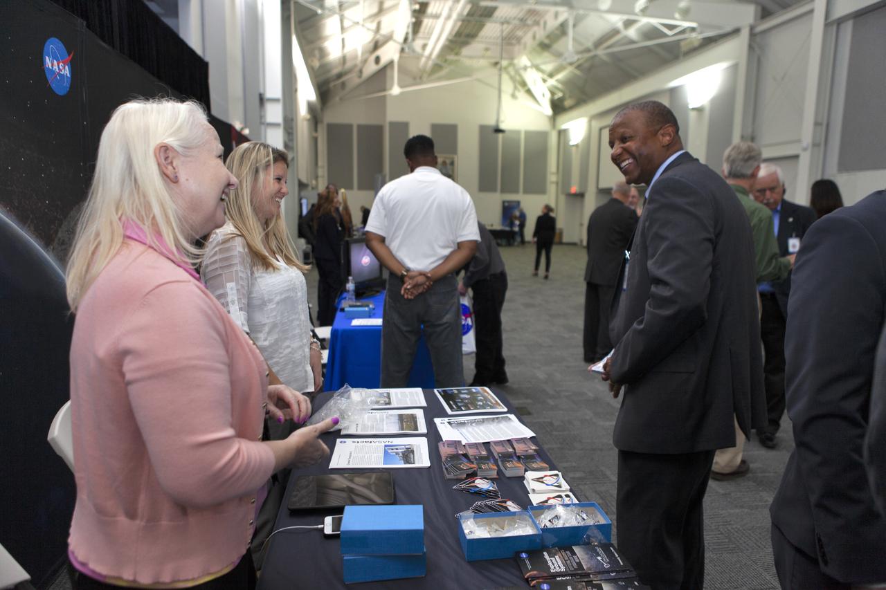 Kelvin Manning, Kennedy associate director, technical, at right, visits with representatives from Exploration Ground Systems during the center director update to community leaders, business executives, partners, educators and government leaders on March 29, 2019, at the Kennedy Space Center Visitor Complex in Florida. Center Director Bob Cabana recapped achievements and future plans for Kennedy-led programs, including the Commercial Crew Program, Exploration Ground Systems, Launch Services Program, Exploration Research and Technology, and Center Planning and Development. After the presentation, guests had the opportunity to ask questions and visit displays from the programs and some of the commercial partners.