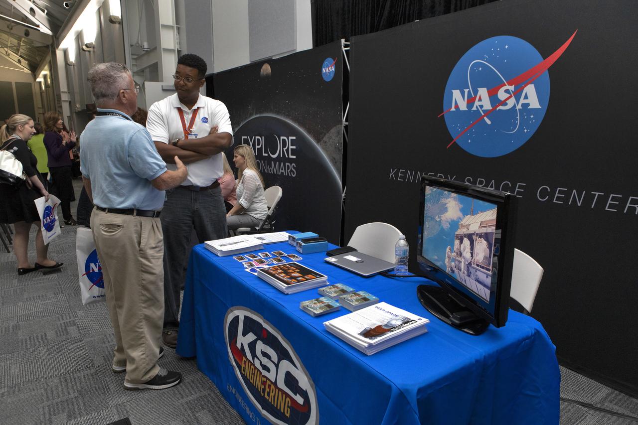 A guest visits with a representative from the Engineering Directorate during NASA Kennedy Space Center Director Bob Cabana’s update to community leaders, business executives, partners, educators and government leaders March 29, 2019, at the Kennedy Space Center Visitor Complex in Florida. Cabana’s presentation covered recent accomplishments and future plans for Kennedy-led programs, including the Commercial Crew Program, Exploration Ground Systems, Launch Services Program, Exploration Research and Technology, and Center Planning and Development. After the presentation, guests had the opportunity to ask questions and visit displays from the programs and some of the commercial partners.