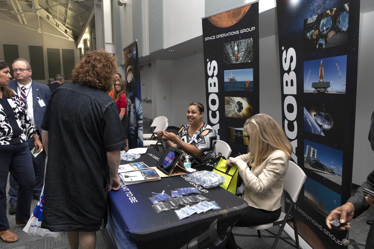 A guest visits with representatives from Jacobs during NASA Kennedy Space Center Director Bob Cabana’s update to community leaders, business executives, partners, educators and government leaders March 29, 2019, at the Kennedy Space Center Visitor Complex in Florida. Cabana’s presentation covered recent accomplishments and future plans for Kennedy-led programs, including the Commercial Crew Program, Exploration Ground Systems, Launch Services Program, Exploration Research and Technology, and Center Planning and Development. After the presentation, guests had the opportunity to ask questions and visit displays from the programs and some of the commercial partners.