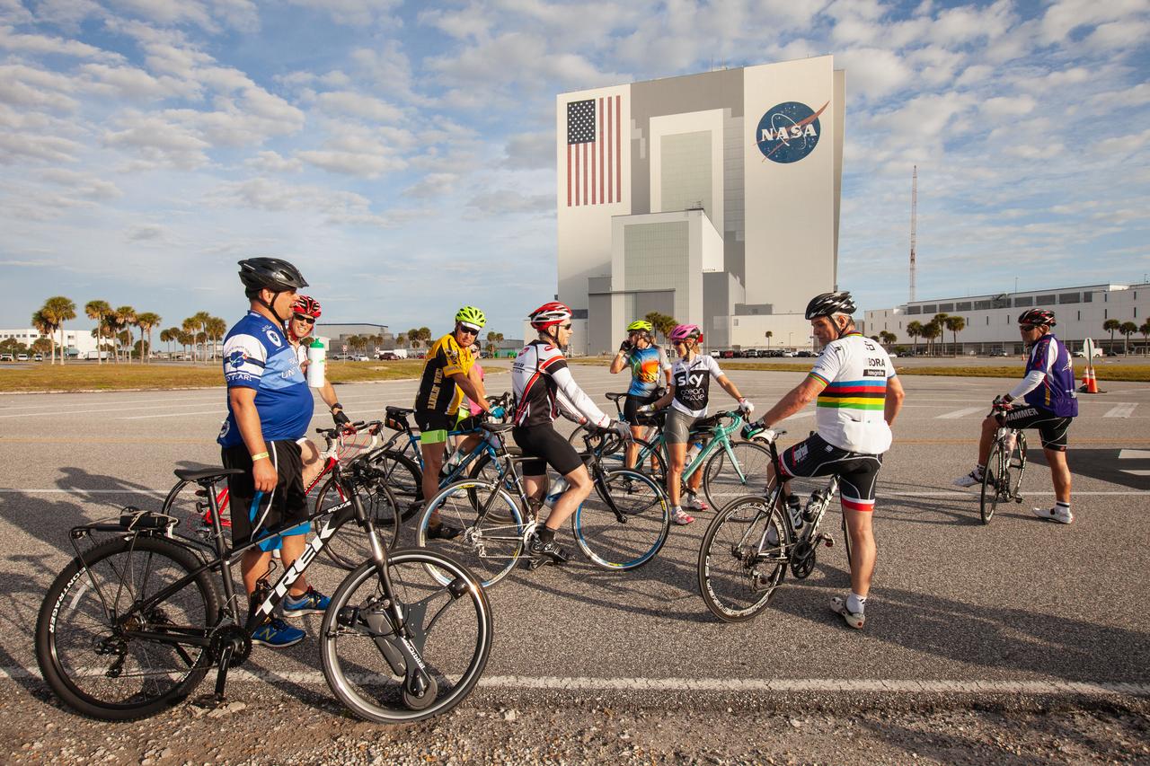 Cyclists pause in front of the Vehicle Assembly Building (VAB) to rest during Kennedy Space Center’s annual Tour de KSC. The bicycle tour took place March 30, giving Kennedy employees and guests the opportunity to choose from three different routes that ranged from seven to 33 miles along some of the Florida spaceport’s most notable facilities such as the VAB, the Shuttle Landing Facility and historic Launch Pad 39A, among others. 