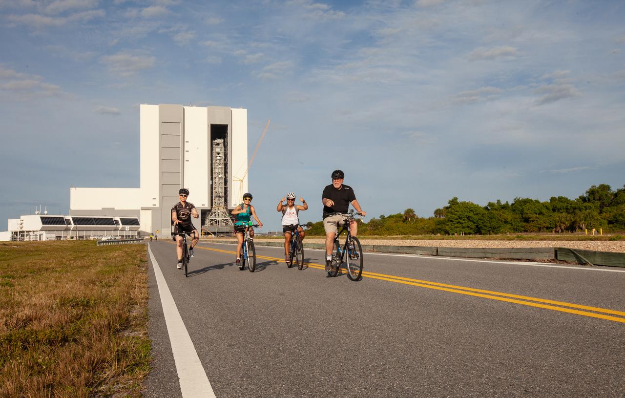 Cyclists pedal away from the Vehicle Assembly Building (VAB) and Launch Control Center, continuing on the Kennedy Space Center’s annual Tour de KSC. The bicycle tour took place March 30, giving Kennedy employees and guests the opportunity to choose from three different routes that ranged from seven to 33 miles along some of the Florida spaceport’s most notable facilities such as the VAB, the Shuttle Landing Facility and historic Launch Pad 39A, among others. 