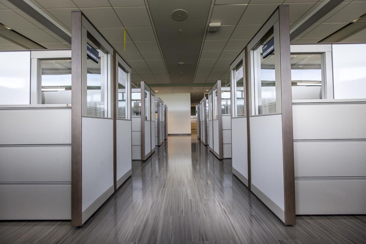 A view of some of the work stations in the new headquarters building on April 3, 2019, at NASA’s Kennedy Space Center in Florida. The newly constructed facility anchors the multi-user spaceport’s Central Campus. More than 500 civil service and contractor employees will be based in the 200,000-square-foot building. The facility earned the U.S. Green Building Council’s Leadership in Energy and Environmental Design (LEED) Gold designation. Features include LED lighting throughout, along with occupancy sensors to turn off unneeded lights; windows, screens and shades designed to maximize natural light; chilled beam HVAC technology reducing the need for ductwork, and more.