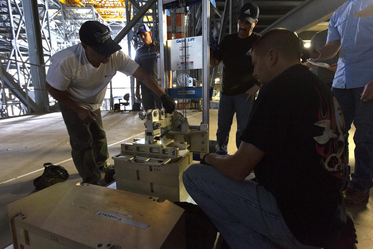 A Space Launch System (SLS) avionics handling tool demonstration takes place inside Kennedy Space Center’s Vehicle Assembly Building on April 4, 2019. The demonstration showed that avionics boxes could be successfully and safely mounted into the SLS rocket’s upper stage — called the Interim Cryogenic Propulsion Stage, or ICPS — with low risk of damaging a closely located hydrazine tank. Avionics boxes include the Inertial Navigation and Control Assembly and flight batteries. The actual installation will take place just weeks before NASA’s SLS rocket and uncrewed Orion spacecraft lift off on Exploration Mission-1 from Launch Pad 39B at Kennedy.