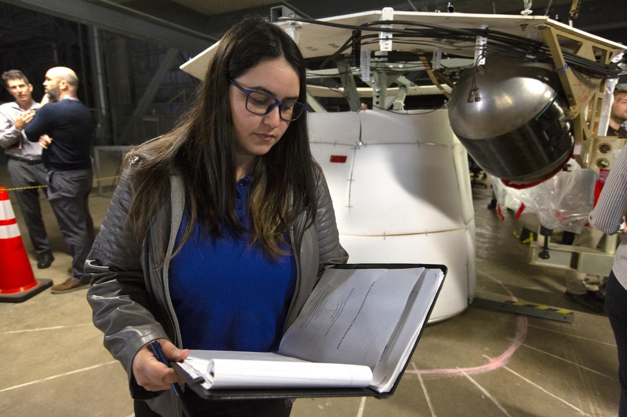 NASA Flight Systems Engineer Sherild Rivera Melendez takes notes during the Space Launch System avionics handling tool demonstration inside Kennedy Space Center’s Vehicle Assembly Building on April 4, 2019. The demonstration showed that avionics boxes could be successfully and safely mounted into the SLS rocket’s upper stage — called the Interim Cryogenic Propulsion Stage, or ICPS — with low risk of damaging a closely located hydrazine tank. Avionics boxes include the Inertial Navigation and Control Assembly and flight batteries. Rivera Melendez coordinated multiple human factors teams, focusing on life cycle reviews and impact risks during installation of the avionics.