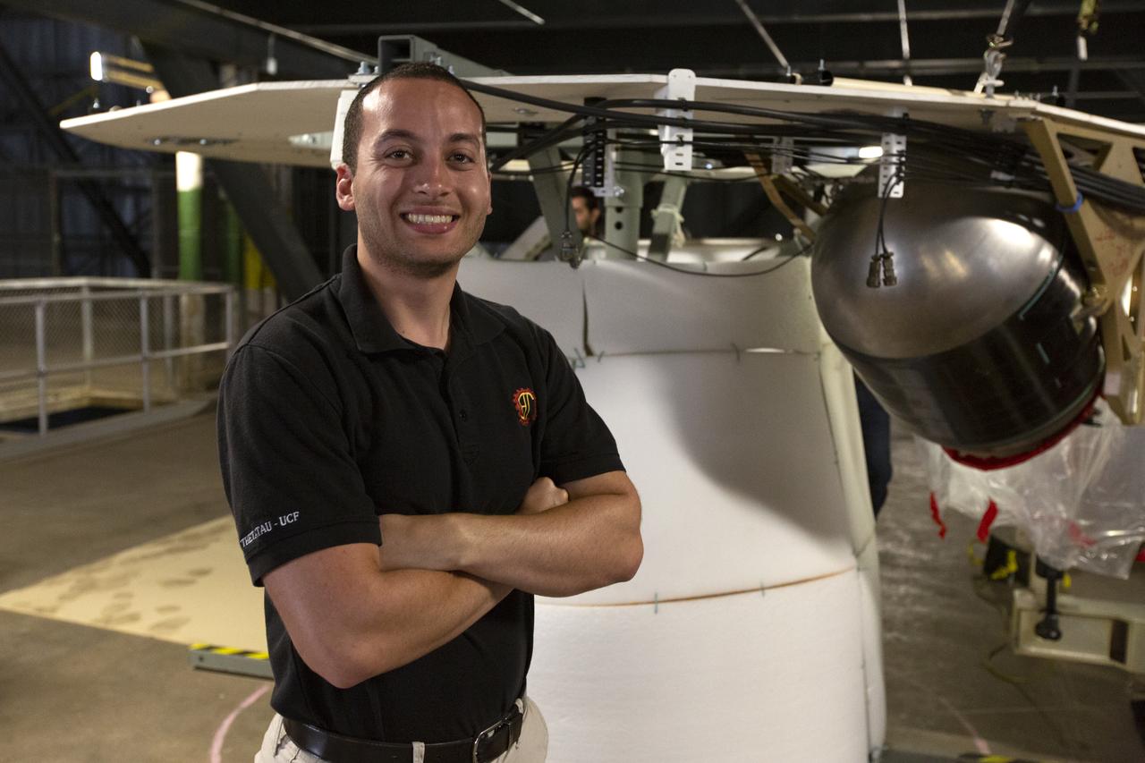 Christopher Di Taranto, a member of the mechanical structures engineering team on the Jacobs Test and Operations Contract, stands in front of an Interim Cryogenic Propulsion Stage (ICPS) mockup during the Space Launch System avionics handling tool demonstration inside Kennedy Space Center’s Vehicle Assembly Building on April 4, 2019. The demonstration showed that avionics boxes could be successfully mounted into the SLS rocket’s upper stage safely, and with low risk of damaging a closely located hydrazine tank. Avionics boxes include the Inertial Navigation and Control Assembly and flight batteries. Di Taranto led a team to quickly resolve a non-conformance issue with the tool.