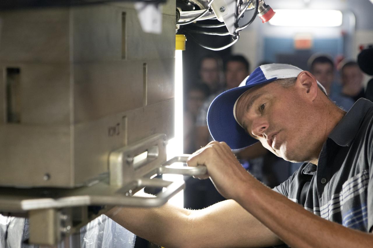 A Space Launch System (SLS) avionics handling tool demonstration takes place inside Kennedy Space Center’s Vehicle Assembly Building on April 4, 2019. The demonstration showed that avionics boxes could be successfully and safely mounted into the SLS rocket’s upper stage — called the Interim Cryogenic Propulsion Stage, or ICPS — with low risk of damaging a closely located hydrazine tank. Avionics boxes include the Inertial Navigation and Control Assembly and flight batteries. The actual installation will take place just weeks before NASA’s SLS rocket and uncrewed Orion spacecraft lift off on Exploration Mission-1 from Launch Pad 39B at Kennedy.