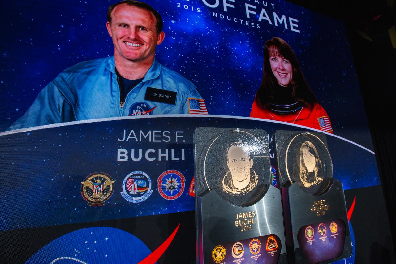 Veteran NASA astronauts James Buchli and Janet Kavandi were inducted into the U.S. Astronaut Hall of Fame in a public ceremony at Kennedy Space Center Visitor Complex in the Space Shuttle Atlantis attraction on April 6, 2019.