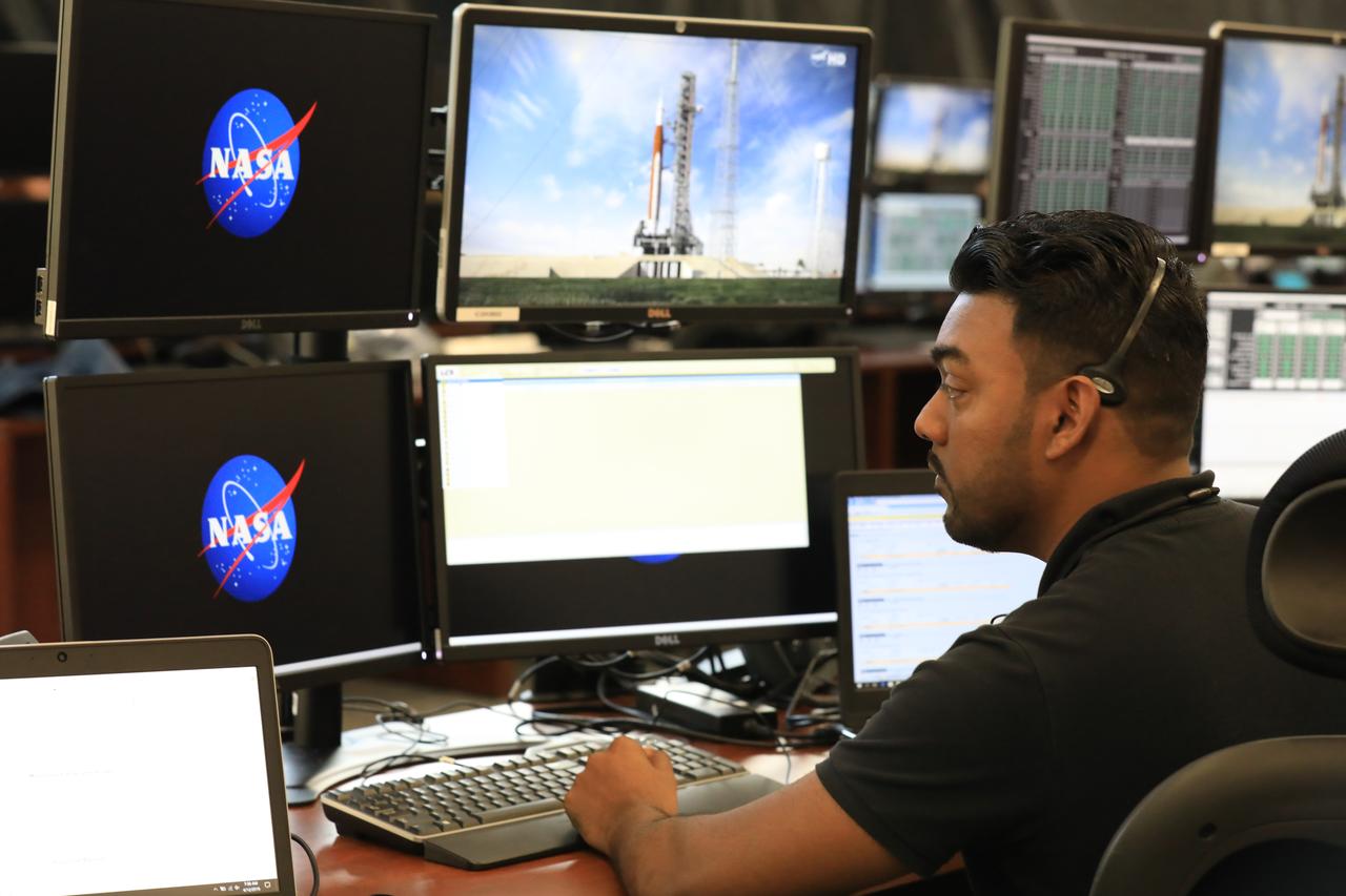 Anthony Bharrat, NASA engine avionics engineer, monitors his console during a countdown demonstration event of cryogenic propellant loading April 12, 2019, inside Firing Room 2 in the Launch Control Center at NASA’s Kennedy Space Center in Florida. The practice simulation involved loading of liquid hydrogen and liquid oxygen into the Space Launch System rocket’s core and upper stages to prepare for Exploration Mission-1 (EM-1). During the tanking exercise, the team worked through surprise issues in real-time. The practice countdown events are training opportunities coordinated by EM-1 Launch Director Charlie Blackwell-Thompson with Exploration Ground Systems. 