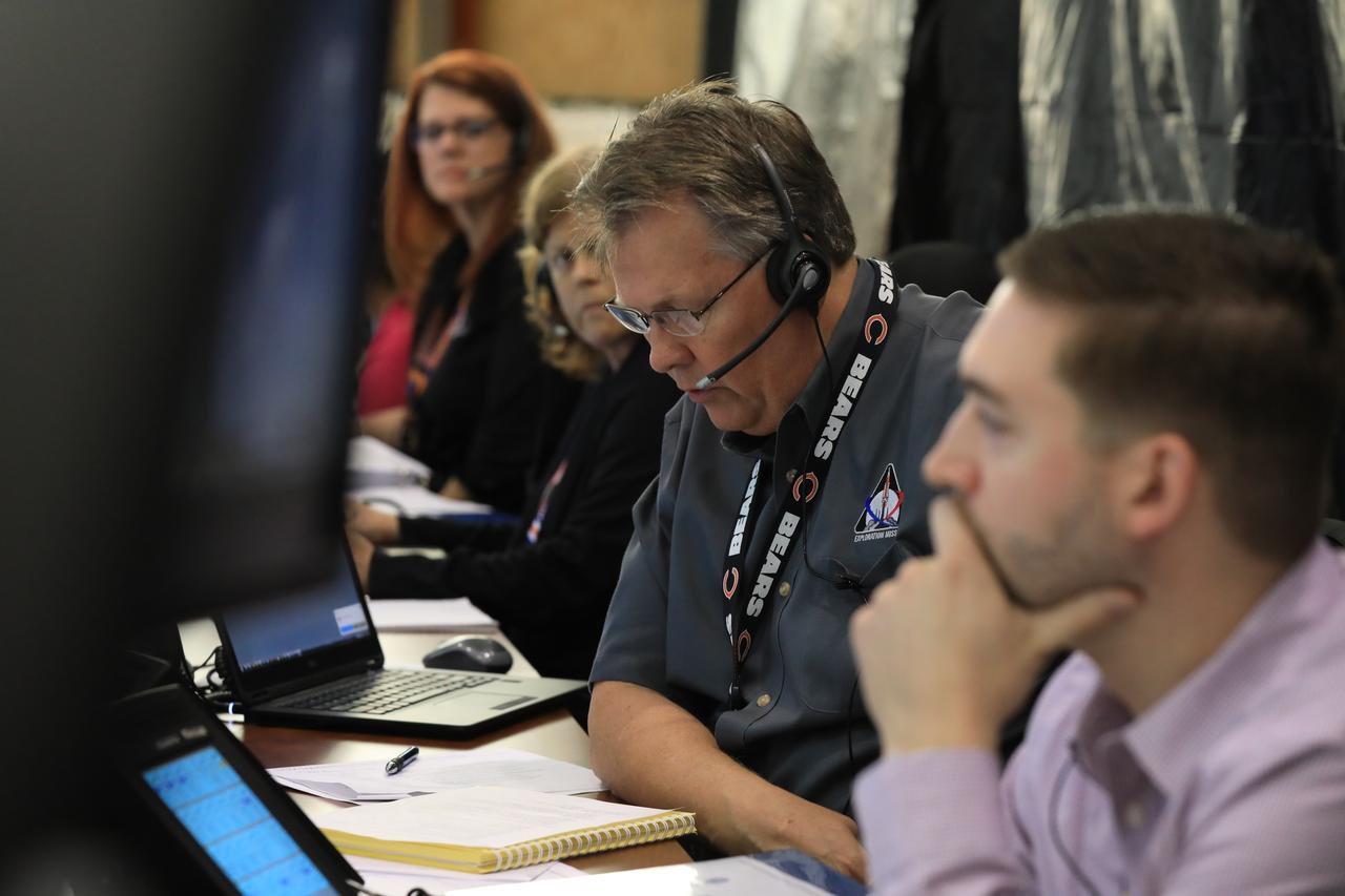 Charlie Blackwell-Thompson, far left, Exploration Mission-1 (EM-1) launch director, and engineers with NASA and Jacobs, participate in a countdown demonstration event of cryogenic propellant loading April 12, 2019, inside Firing Room 2 in the Launch Control Center at NASA’s Kennedy Space Center in Florida. The practice simulation involved loading of liquid hydrogen and liquid oxygen into the Space Launch System rocket’s core and upper stages to prepare for EM-1. During the tanking exercise, the team worked through surprise issues in real-time. The practice countdown events are training opportunities coordinated by Blackwell-Thompson with Exploration Ground Systems.