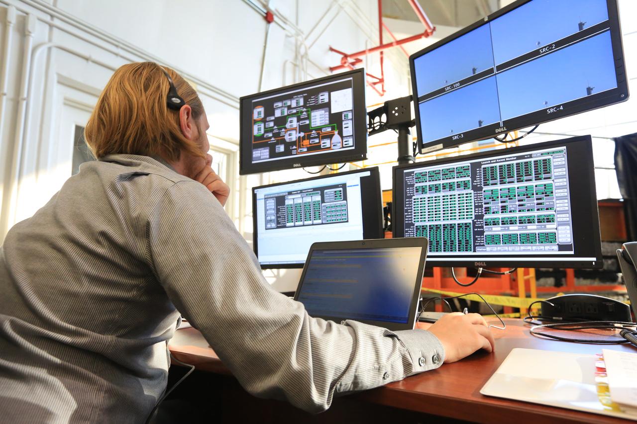 An engineer with NASA monitors his console during a countdown demonstration event of cryogenic propellant loading April 12, 2019, inside Firing Room 2 in the Launch Control Center at NASA’s Kennedy Space Center in Florida. The practice simulation involved loading of liquid hydrogen and liquid oxygen into the Space Launch System rocket’s core and upper stages to prepare for Exploration Mission-1 (EM-1). During the tanking exercise, the team worked through surprise issues in real-time. The practice countdown events are training opportunities coordinated by EM-1 Launch Director Charlie Blackwell-Thompson with Exploration Ground Systems.
