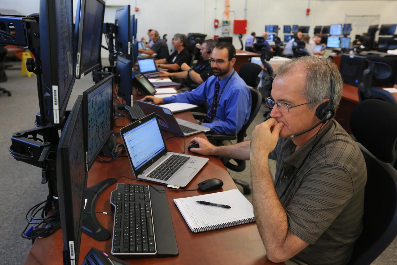 Engineers with NASA and contractor Jacobs monitor their consoles during a countdown demonstration event of cryogenic propellant loading April 12, 2019, inside Firing Room 2 in the Launch Control Center at NASA’s Kennedy Space Center in Florida. The practice simulation involved loading of liquid hydrogen and liquid oxygen into the Space Launch System rocket’s core and upper stages to prepare for Exploration Mission-1 (EM-1). During the tanking exercise, the team worked through surprise issues in real-time. The practice countdown events are training opportunities coordinated by EM-1 Launch Director Charlie Blackwell-Thompson with Exploration Ground Systems.