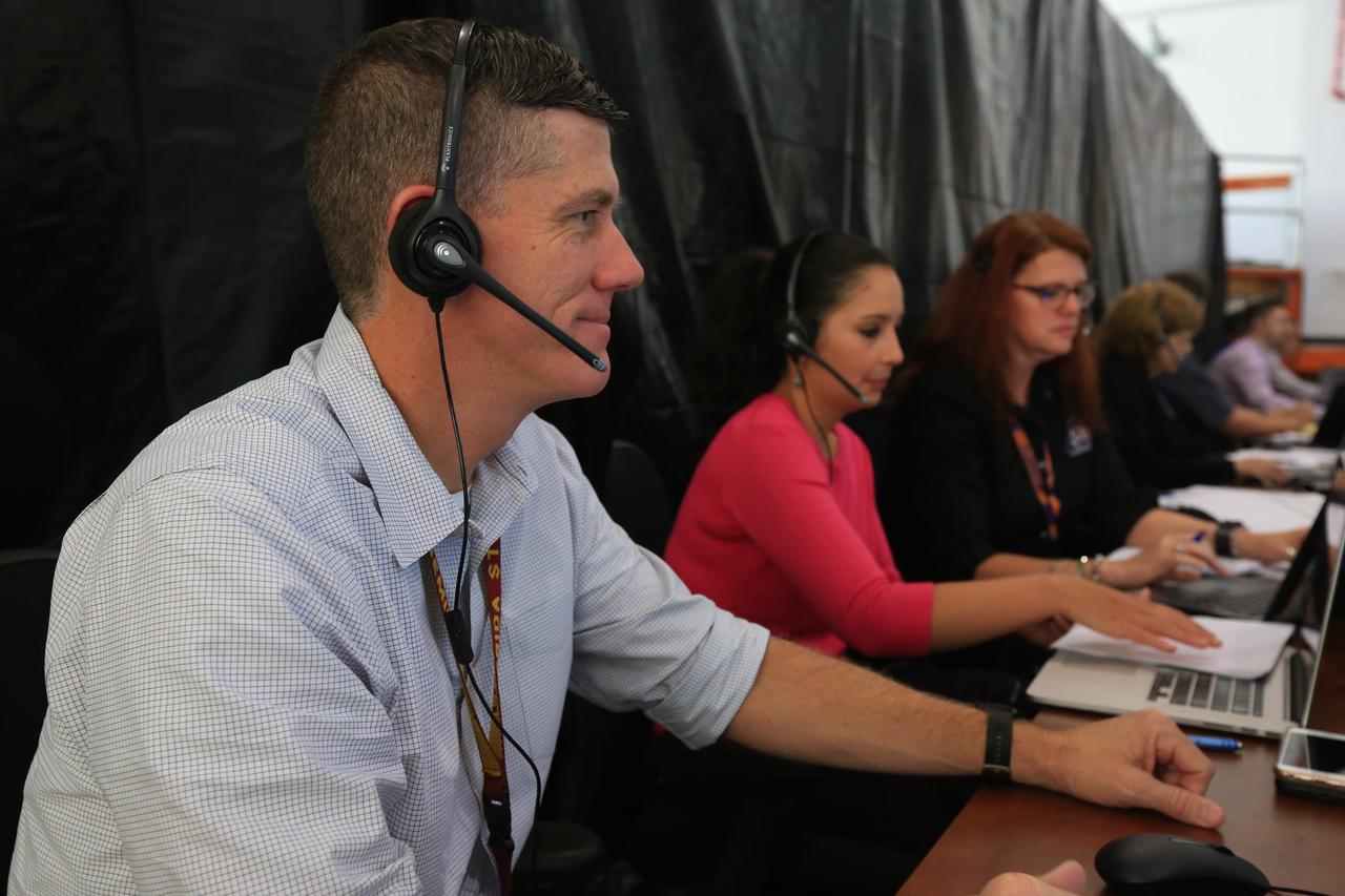 From left, Jeremy Graeber, chief NASA test director; Jessica Parsons, technical assistant to the launch director; and Charlie Blackwell-Thompson, Exploration Mission-1 (EM-1) launch director, participate in a countdown demonstration event of cryogenic propellant loading April 12, 2019, inside Firing Room 2 in the Launch Control Center at NASA’s Kennedy Space Center in Florida. The practice simulation involved loading of liquid hydrogen and liquid oxygen into the Space Launch System rocket’s core and upper stages to prepare for Exploration Mission-1 (EM-1). During the tanking exercise, the team worked through surprise issues in real-time. The practice countdown events are training opportunities coordinated by Blackwell-Thompson with Exploration Ground Systems.