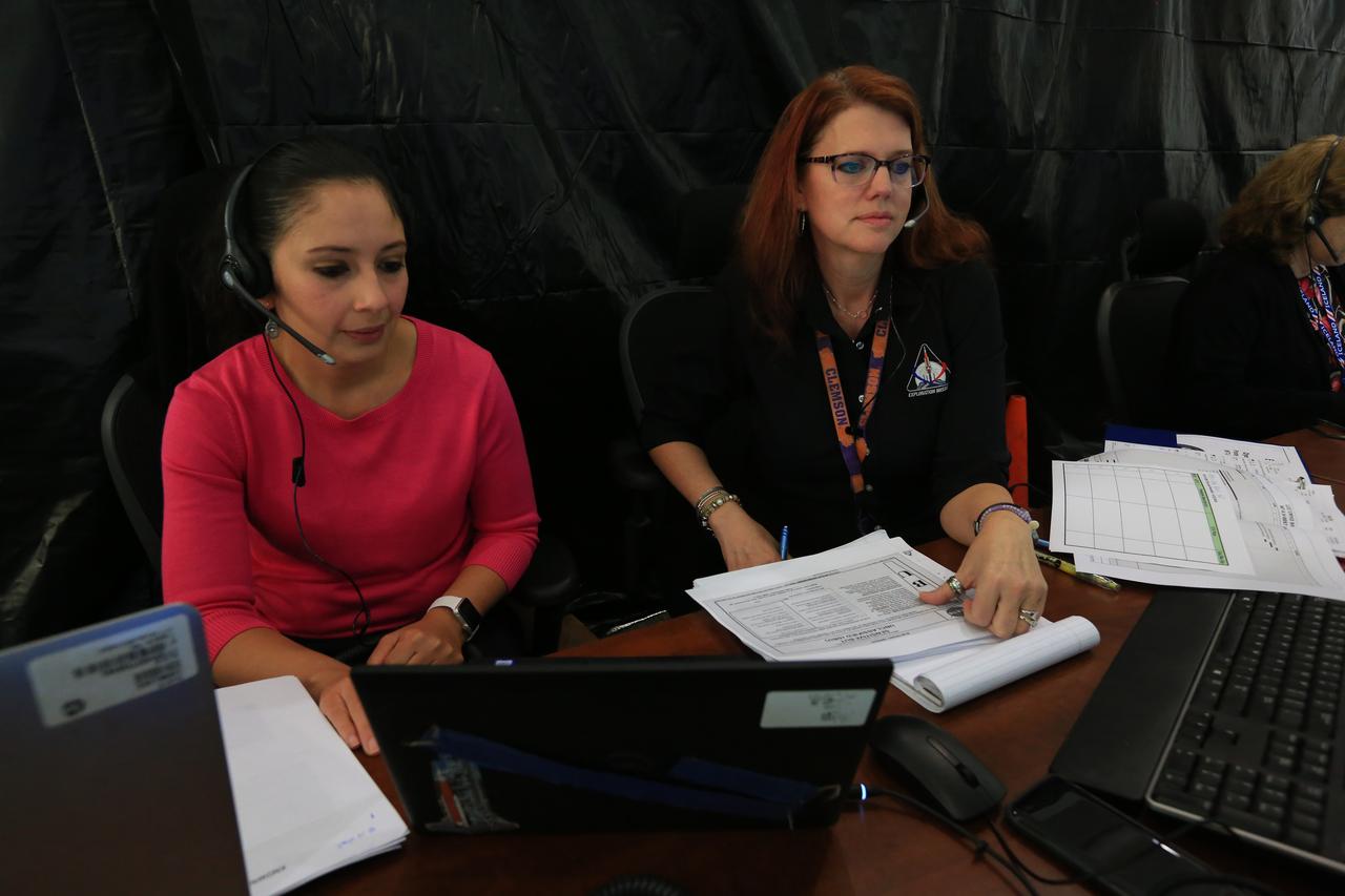 Charlie Blackwell-Thompson, at right, Exploration Mission-1 (EM-1) launch director, leads a countdown demonstration event of cryogenic propellant loading April 12, 2019, inside Firing Room 2 in the Launch Control Center at NASA’s Kennedy Space Center in Florida. Seated next to her is Jessica Parsons, technical assitant to the launch director. The practice simulation involved loading of liquid hydrogen and liquid oxygen into the Space Launch System rocket’s core and upper stages to prepare for EM-1. During the tanking exercise, the team worked through surprise issues in real-time. The practice countdown events are training opportunities coordinated by Blackwell-Thompson with Exploration Ground Systems.