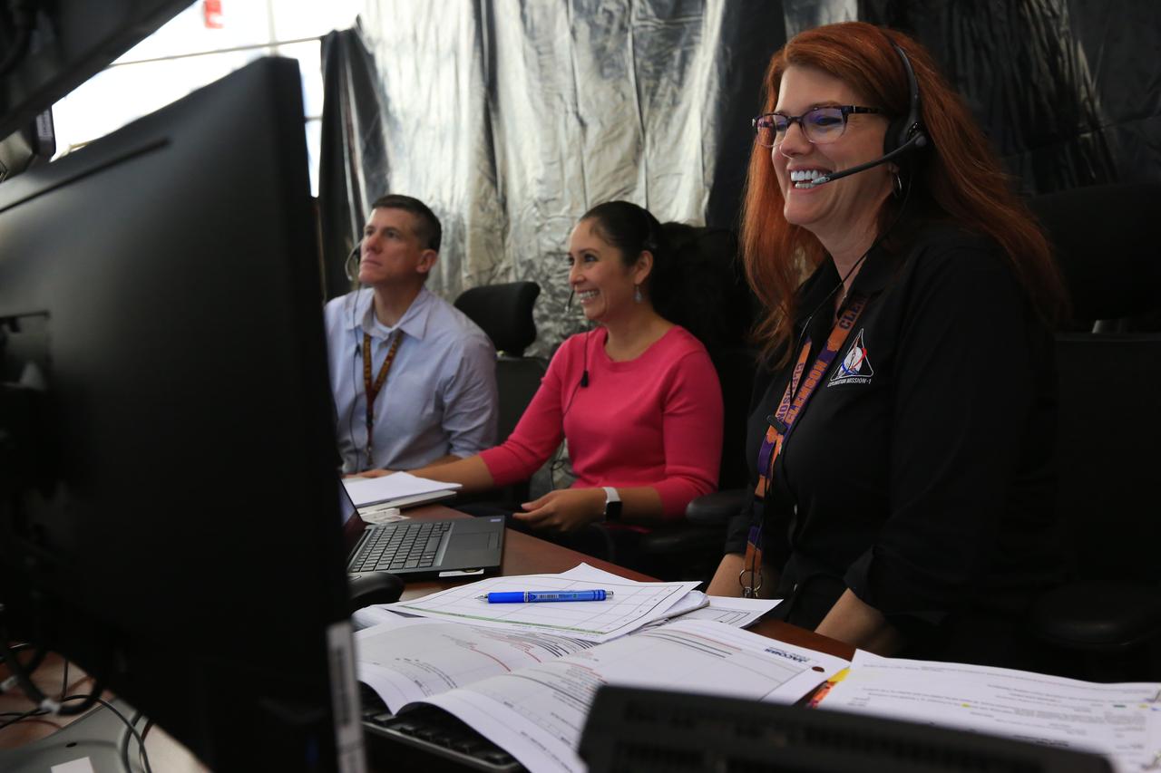 From left, Jeremy Graeber, chief NASA test director; Jessica Parsons, technical assistant to the launch director; and Charlie Blackwell-Thompson, Exploration Mission-1 (EM-1) launch director, participate in a countdown demonstration event of cryogenic propellant loading April 12, 2019, inside Firing Room 2 in the Launch Control Center at NASA’s Kennedy Space Center in Florida. The practice simulation involved loading of liquid hydrogen and liquid oxygen into the Space Launch System rocket’s core and upper stages to prepare for Exploration Mission-1 (EM-1). During the tanking exercise, the team worked through surprise issues in real-time. The practice countdown events are training opportunities coordinated by Blackwell-Thompson with Exploration Ground Systems.