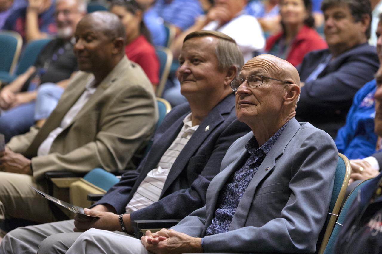 Former space shuttle launch directors Mike Leinbach, left, and Bob Sieck listen to a presentation in Kennedy Space Center’s Training Auditorium on April 12, 2019, during “Columbia: The Mission Continues,” an event organized by the Apollo Challenger Columbia Lessons Learned Program (ACCLLP). The event is part of the Space Shuttle Columbia national tour and took place on the 38th anniversary of STS-1, the first orbital spaceflight of NASA’s Space Shuttle Program. The tour launched at Kennedy and will make its way to each of the 10 NASA centers.