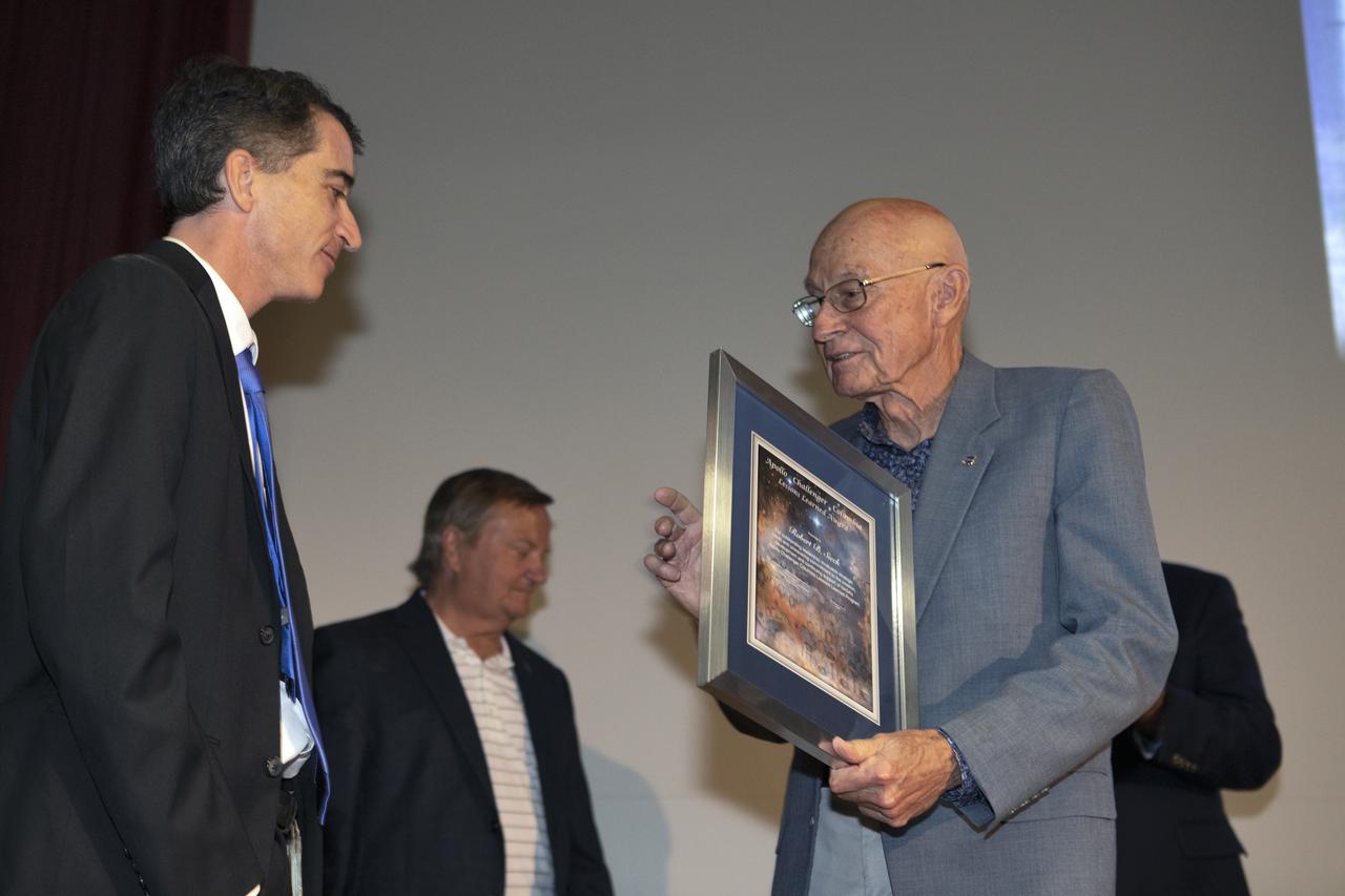 Former space shuttle launch director Bob Sieck, right, receives a Lessons Learned Award from Apollo Challenger Columbia Lessons Learned Program (ACCLLP) Manager Mike Ciannilli in Kennedy Space Center’s Training Auditorium on April 12, 2019. Sieck participated in a discussion during “Columbia: The Mission Continues,” an event organized by the ACCLLP. The event is part of the Space Shuttle Columbia national tour and took place on the 38th anniversary of STS-1, the first orbital spaceflight of NASA’s Space Shuttle Program. The tour launched at Kennedy and will make its way to each of the 10 NASA centers.