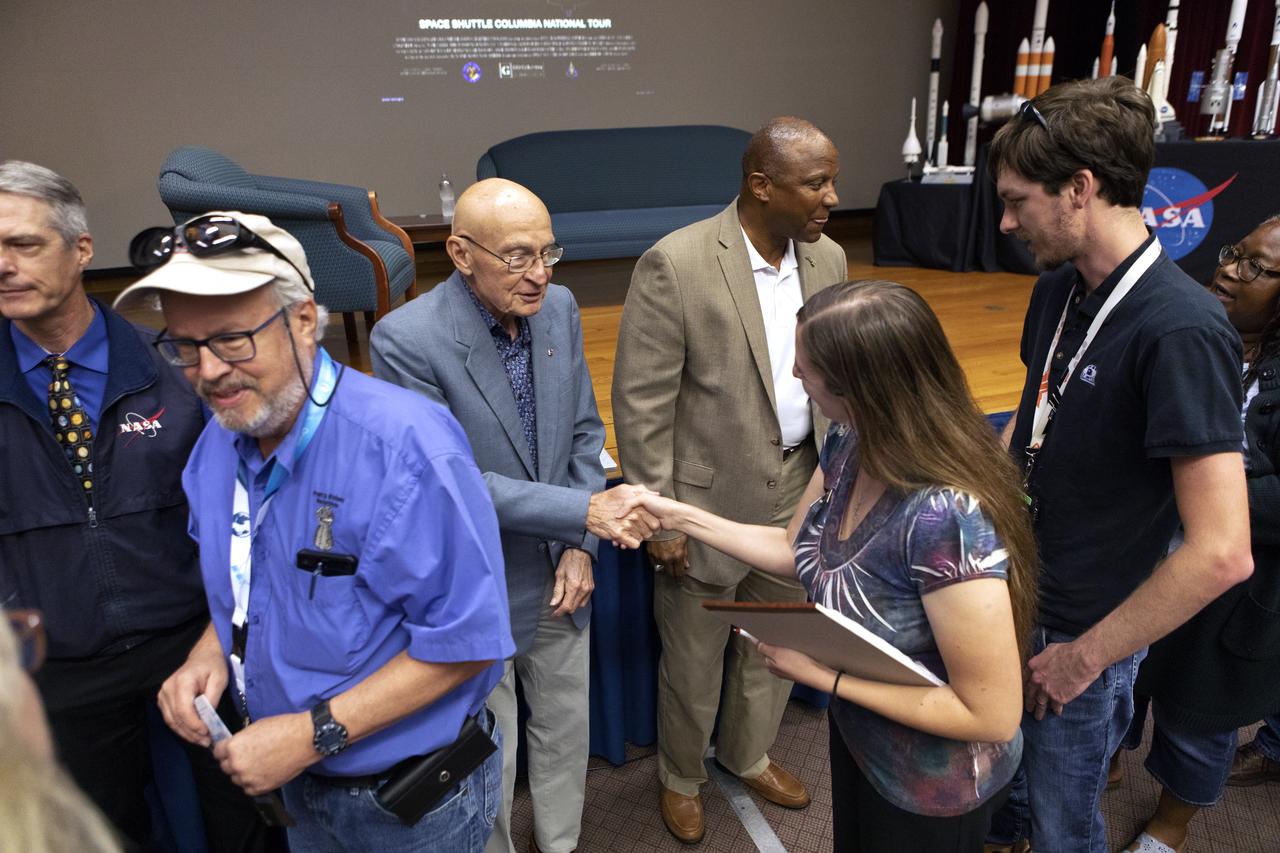 Former space shuttle launch director Bob Sieck shakes hands with an attendee of “Columbia: The Mission Continues,” in Kennedy Space Center’s Training Auditorium on April 12, 2019. Organized by the Apollo Challenger Columbia Lessons Learned Program (ACCLLP), the event is part of the Space Shuttle Columbia national tour and took place on the 38th anniversary of STS-1, the first orbital spaceflight of NASA’s Space Shuttle Program. The tour launched at Kennedy and will make its way to each of the 10 NASA centers.