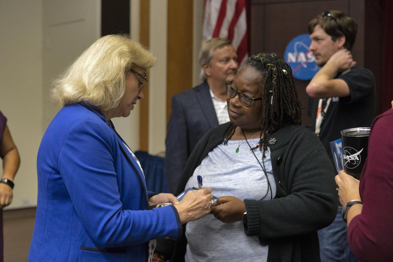 Evelyn Husband Thompson, widow of STS-107 Commander Rick Husband, talks with an attendee of “Columbia: The Mission Continues,” in Kennedy Space Center’s Training Auditorium on April 12, 2019. Organized by the Apollo Challenger Columbia Lessons Learned Program (ACCLLP), the event is part of the Space Shuttle Columbia national tour and took place on the 38th anniversary of STS-1, the first orbital spaceflight of NASA’s Space Shuttle Program. The tour launched at Kennedy and will make its way to each of the 10 NASA centers.