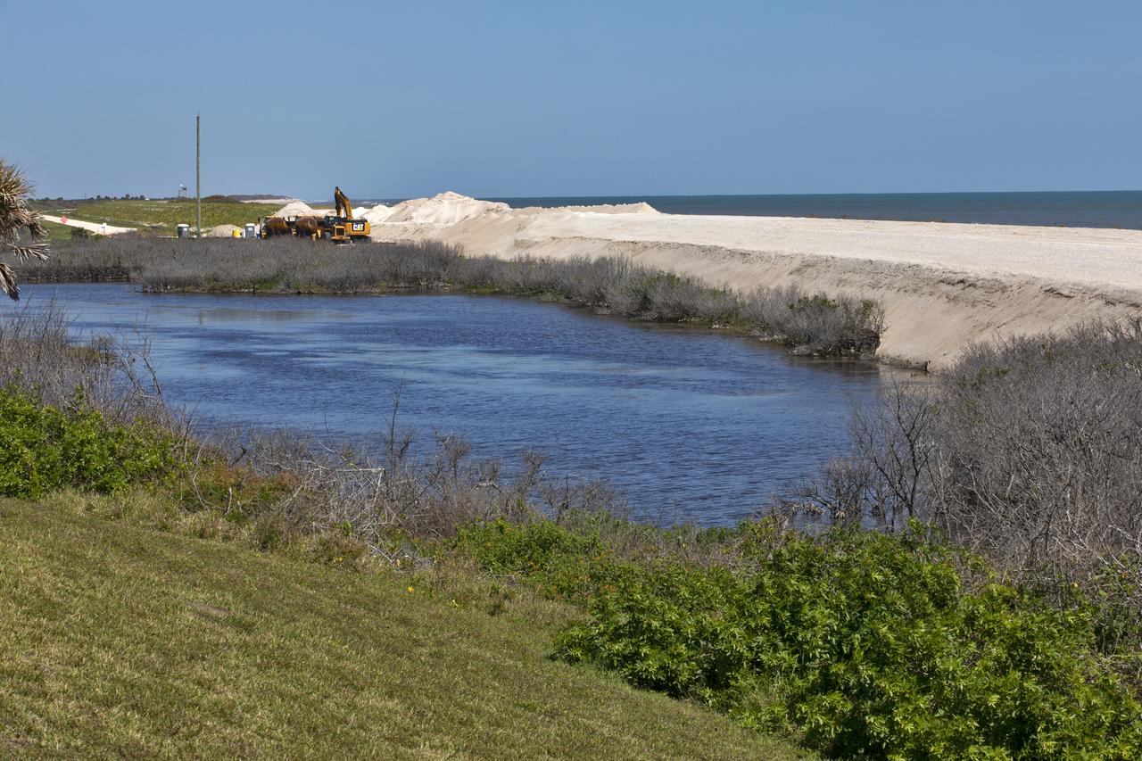 Restoration efforts are underway to the dunes at the north beaches at NASA’s Kennedy Space Center in Florida in this view on April 15, 2019. About 450,000 cubic yards of beach-quality sand, tested for compatibility, was transported to the space center’s beaches. Once the dune is built up, native coastal vegetation will be replanted, helping to stabilize the dune and offer a habitat for Kennedy’s coastal wildlife. Dunes are affected by beach erosion and storm surge from tropical events, such as hurricanes. Restoration began in spring 2018 and was targeted to be completed by April 2019.
